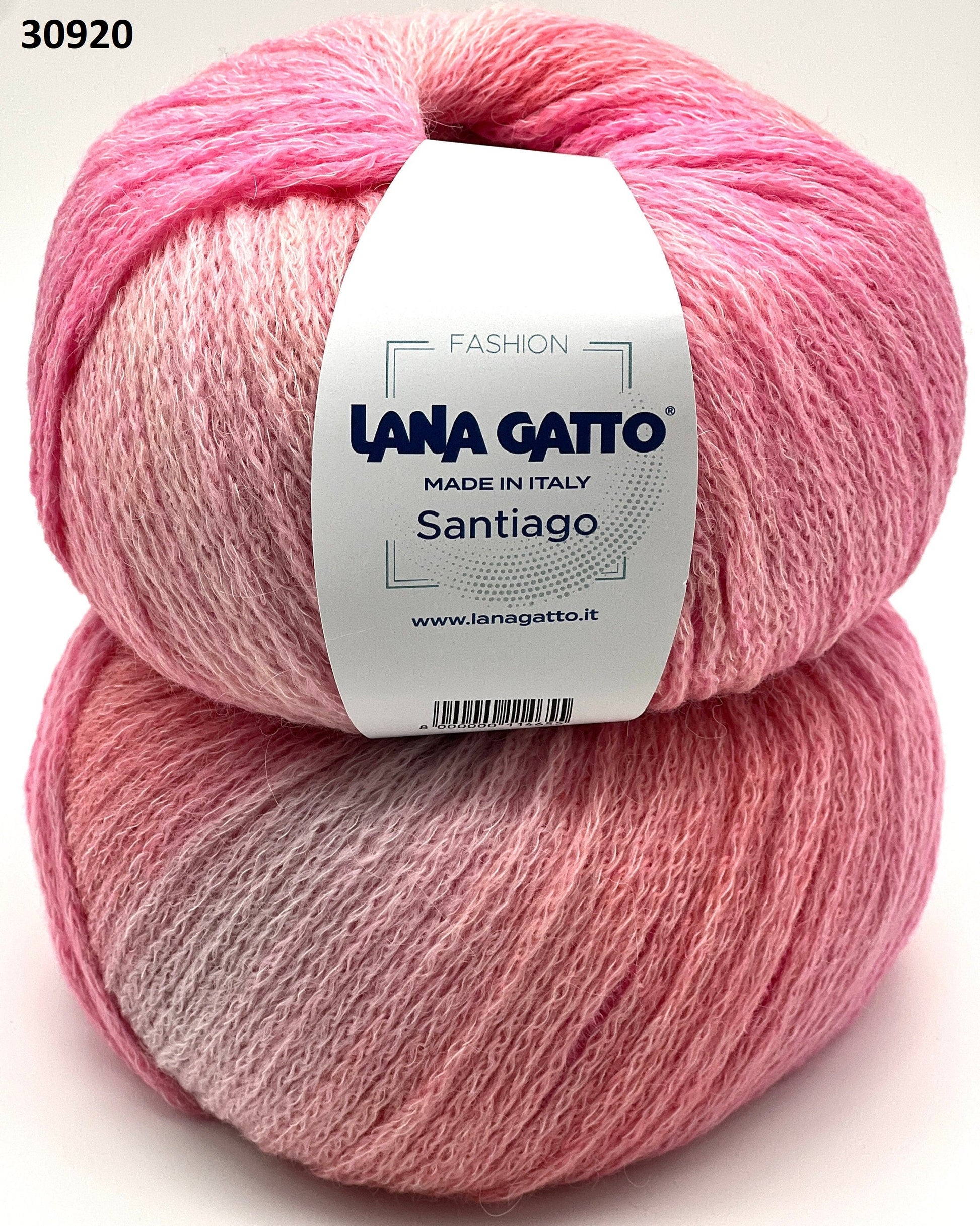 Two pink skeins of yarn with a Lana Gatto label on a light pink background