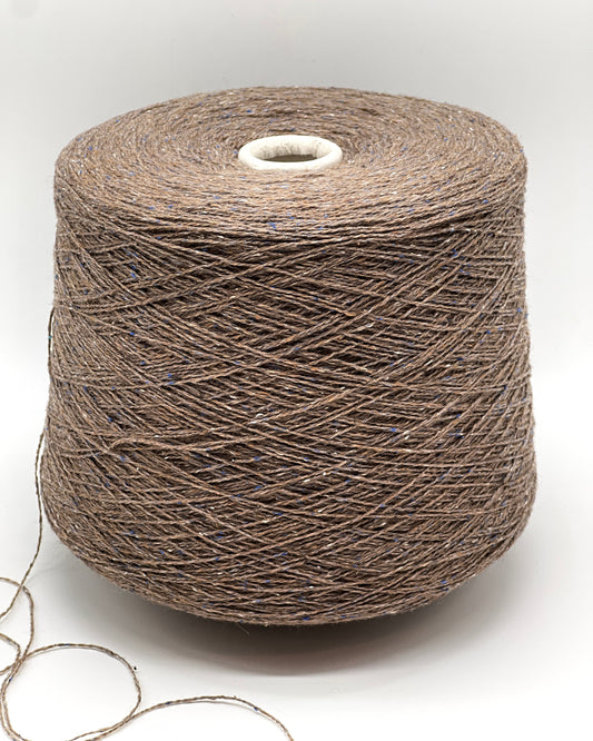 Luxury iDOKNiT lace weight tweed yarn, PIGALLE by RiGo Italy. Sophisticated blend of 40% virgin wool and 20% silk, 750m/100g. Authentic Italian-made tweed featuring a cocoa base with blue and cream flecks, curated by iDOKNiT for elegant, multi-textured garments with a soft silk finish.