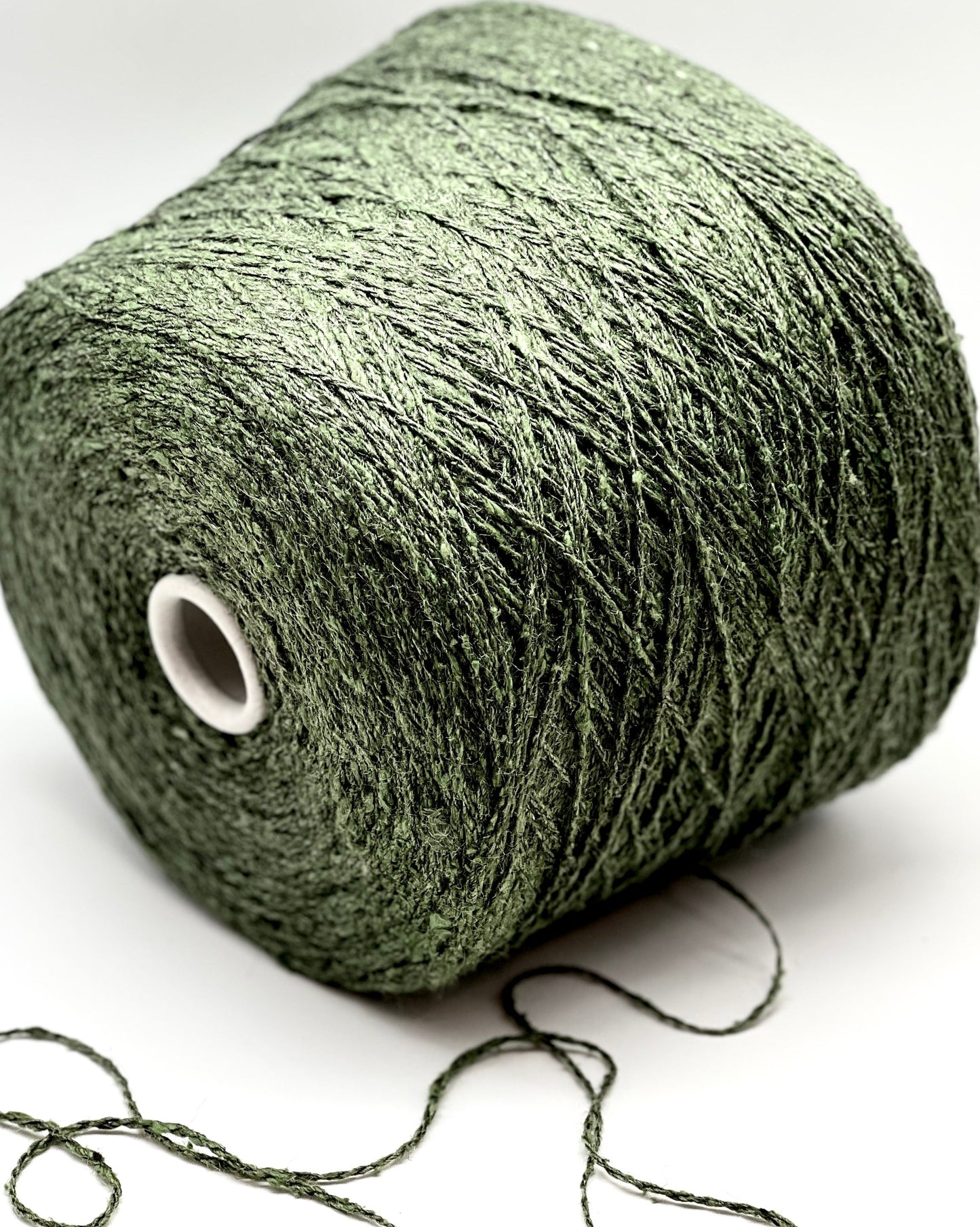 Green skein of yarn on a white background