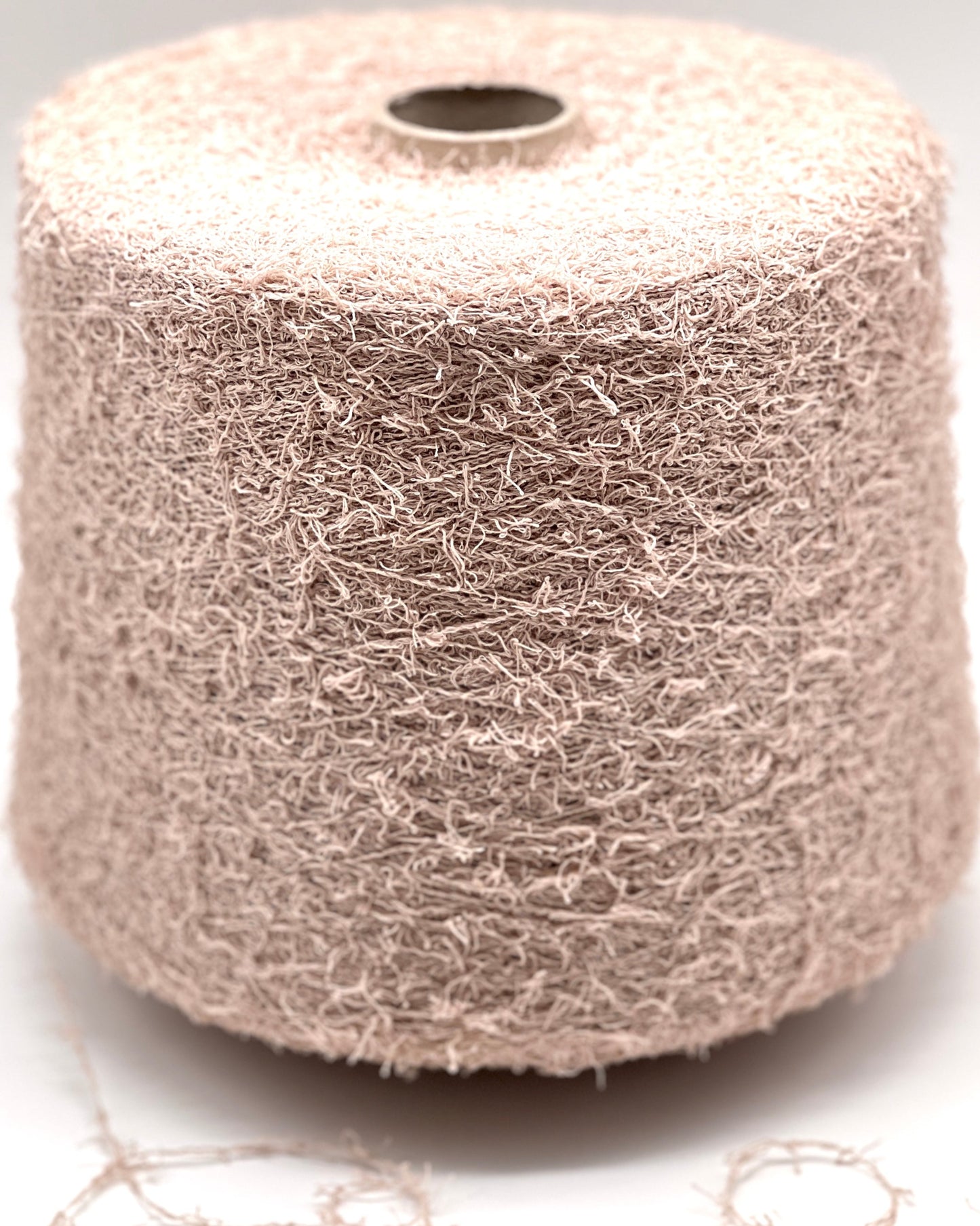 Spool of wire mesh on a white background