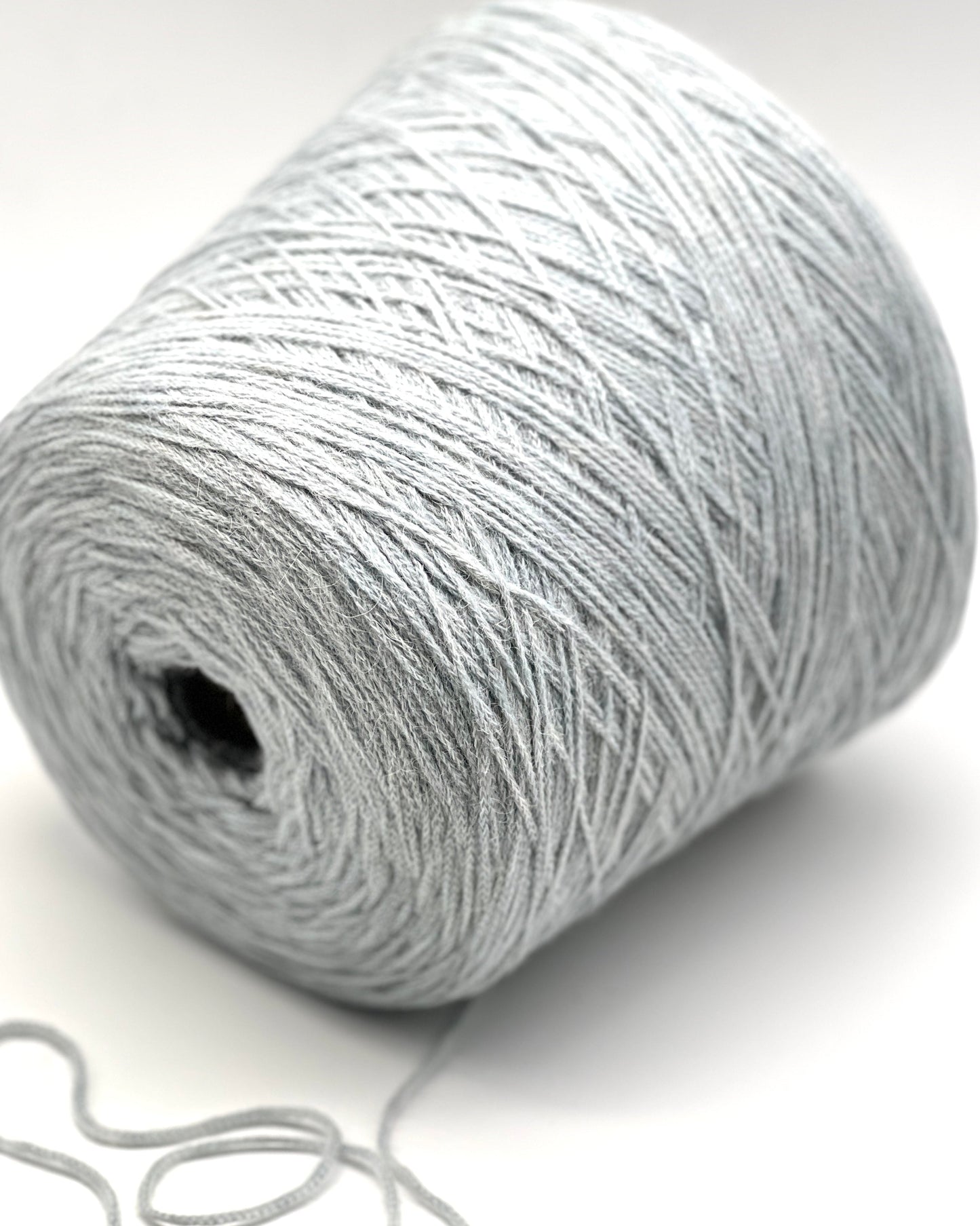 Ball of gray yarn on a white background