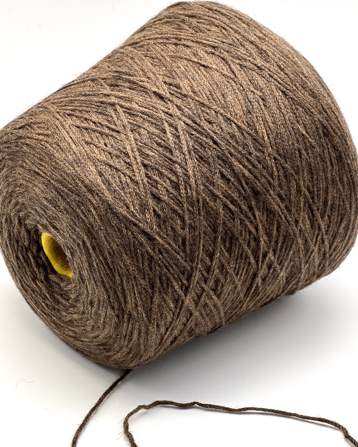 Brown yarn roll on a white background