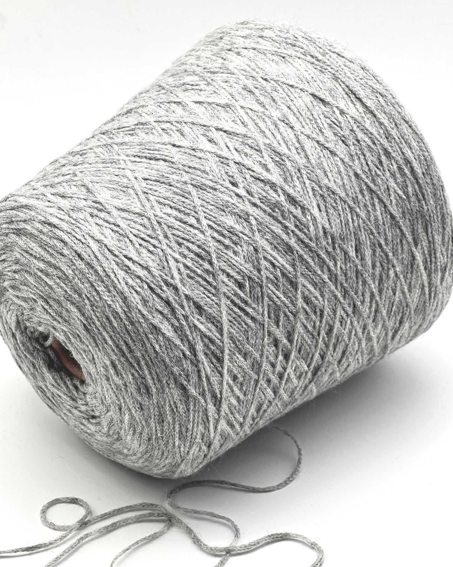 Gray skein of yarn on a white background