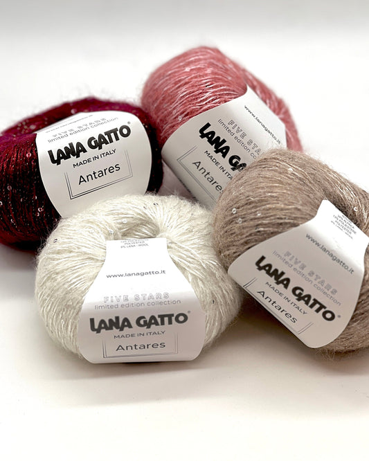Lana Gatto ANTARES alpaca paillettes yarn soft sparkling Italian fingering yarn
Luxury Italian fingering yarn ANTARES with alpaca halo and refined shimmer
Close up of ANTARES yarn showing sparkle paillettes and soft texture
Alpaca wool paillettes yarn ANTARES for shawls sweaters and accessories
Elegant sparkle yarn ANTARES for festive lightweight knitwear