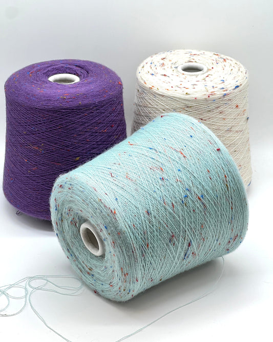 Ri.Go Slubby extrafine merino lace yarn with viscose neps from iDOKNiT. Premium Italian-spun speckled nep tweed fiber for soft, textured luxury knitting and weaving, 1400m per 100g.