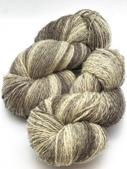 Exclusive iDOKNiT rare heritage yarn, 100% Romanov Sheep Wool 6.2 from Paces Vilnas Fabrika, Latvia. A professionally spun 6/2 two-ply DK weight that offers superior body and stability compared to single-ply versions while retaining 70% natural lanolin. Curated by iDOKNiT in natural grey and tweed-depth dyed shades for high-warmth, weather-resistant heritage sweaters and robust outdoor accessories.