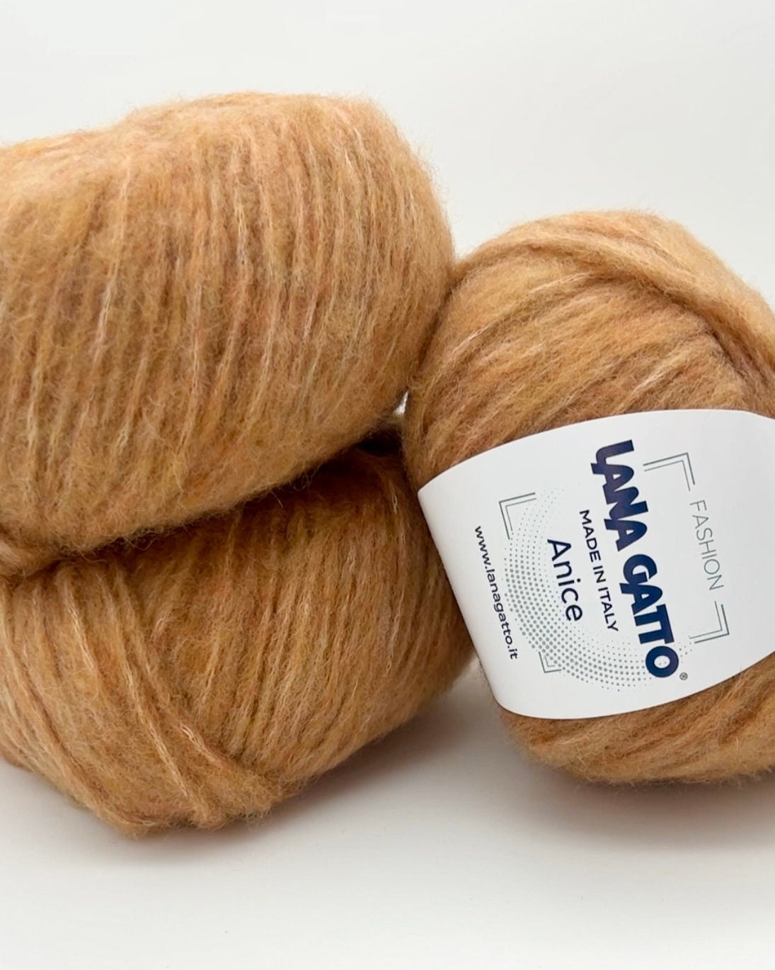 Two skeins of brown yarn with a Lana Grossa label on a white background