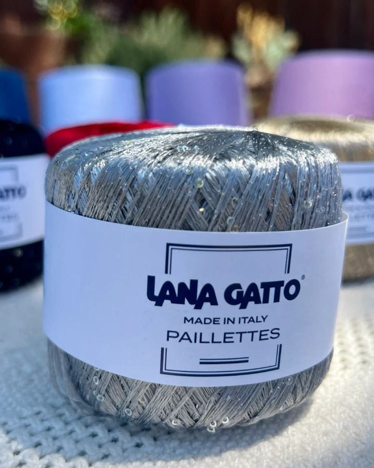 Lana Gatto Paillettes yarn in shimmering pastel tones, with delicate 2mm sequins, lightweight polyester yarn ideal for adding sparkle to knit or crochet projects. Made in Italy. 8603 Silver color.