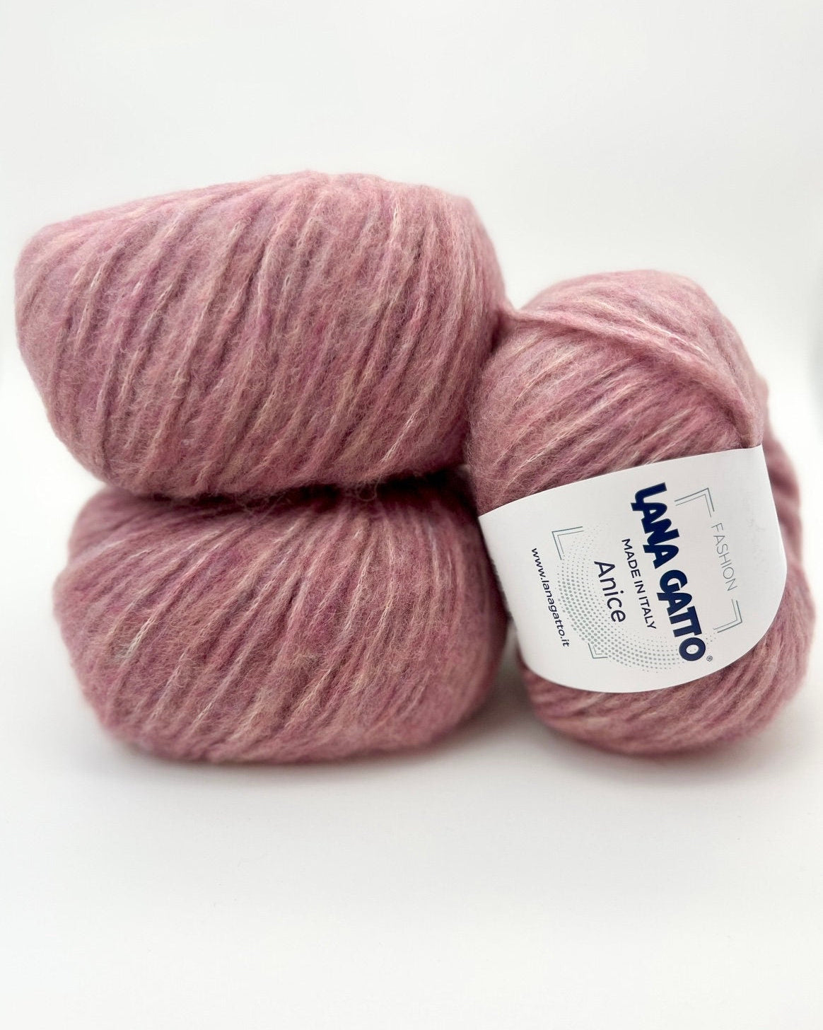 Two pink skeins of yarn with a label on a white background
