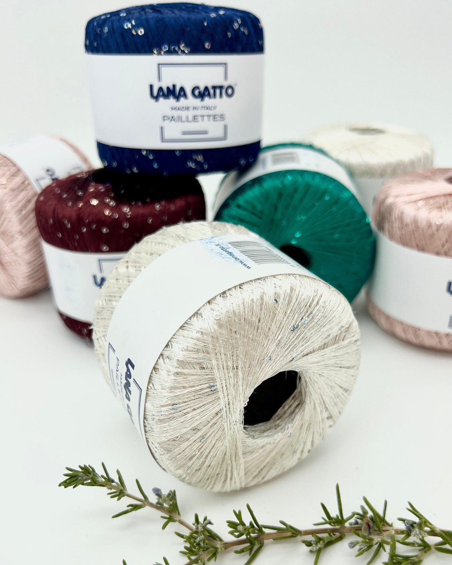 Lana Gatto Paillettes yarn in shimmering pastel tones, with delicate 2mm sequins, lightweight polyester yarn ideal for adding sparkle to knit or crochet projects. Made in Italy. 30101 Red color.