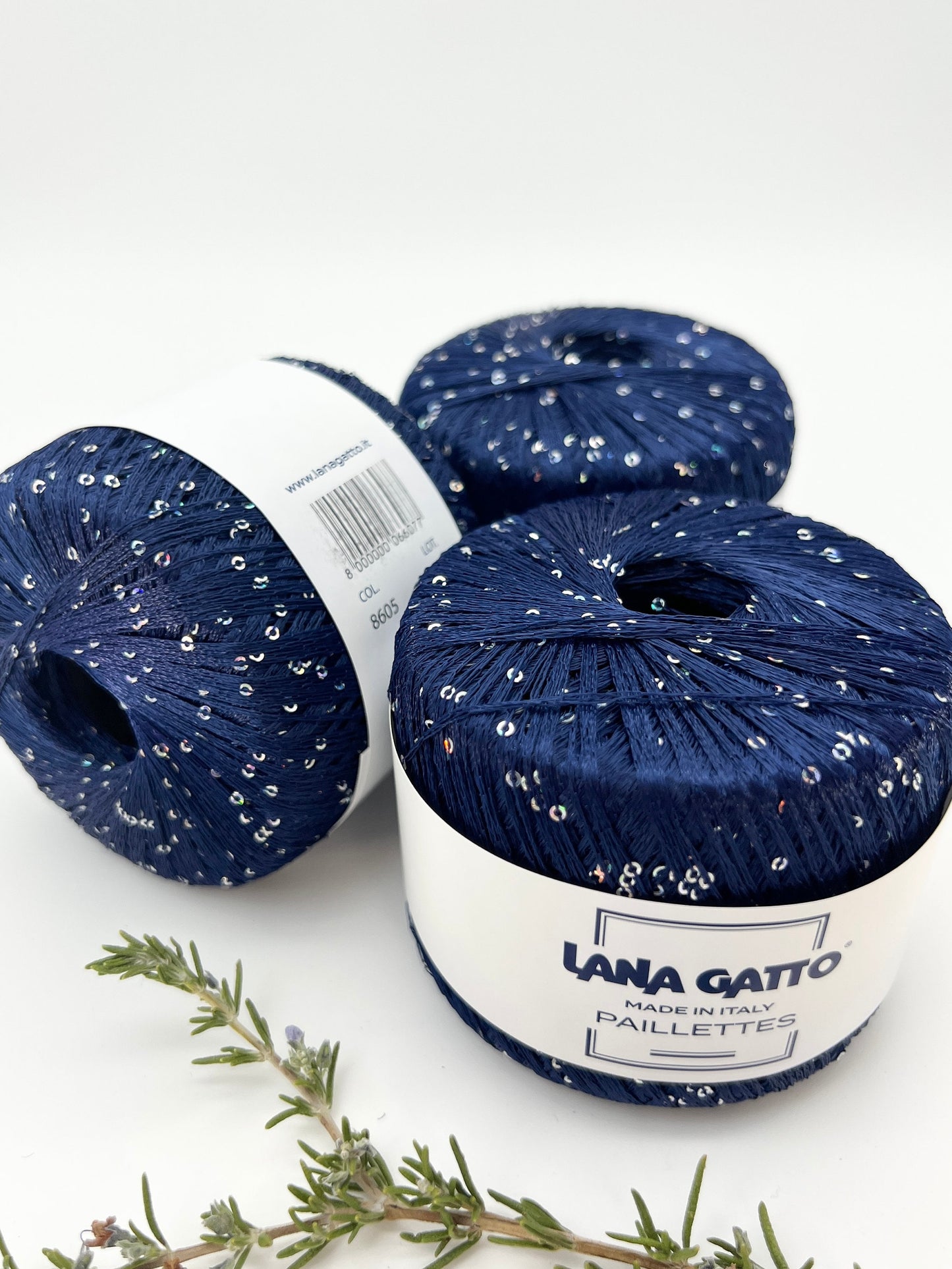 Lana Gatto Paillettes yarn in shimmering pastel tones, with delicate 2mm sequins, lightweight polyester yarn ideal for adding sparkle to knit or crochet projects. Made in Italy. 8605 dark blue color.