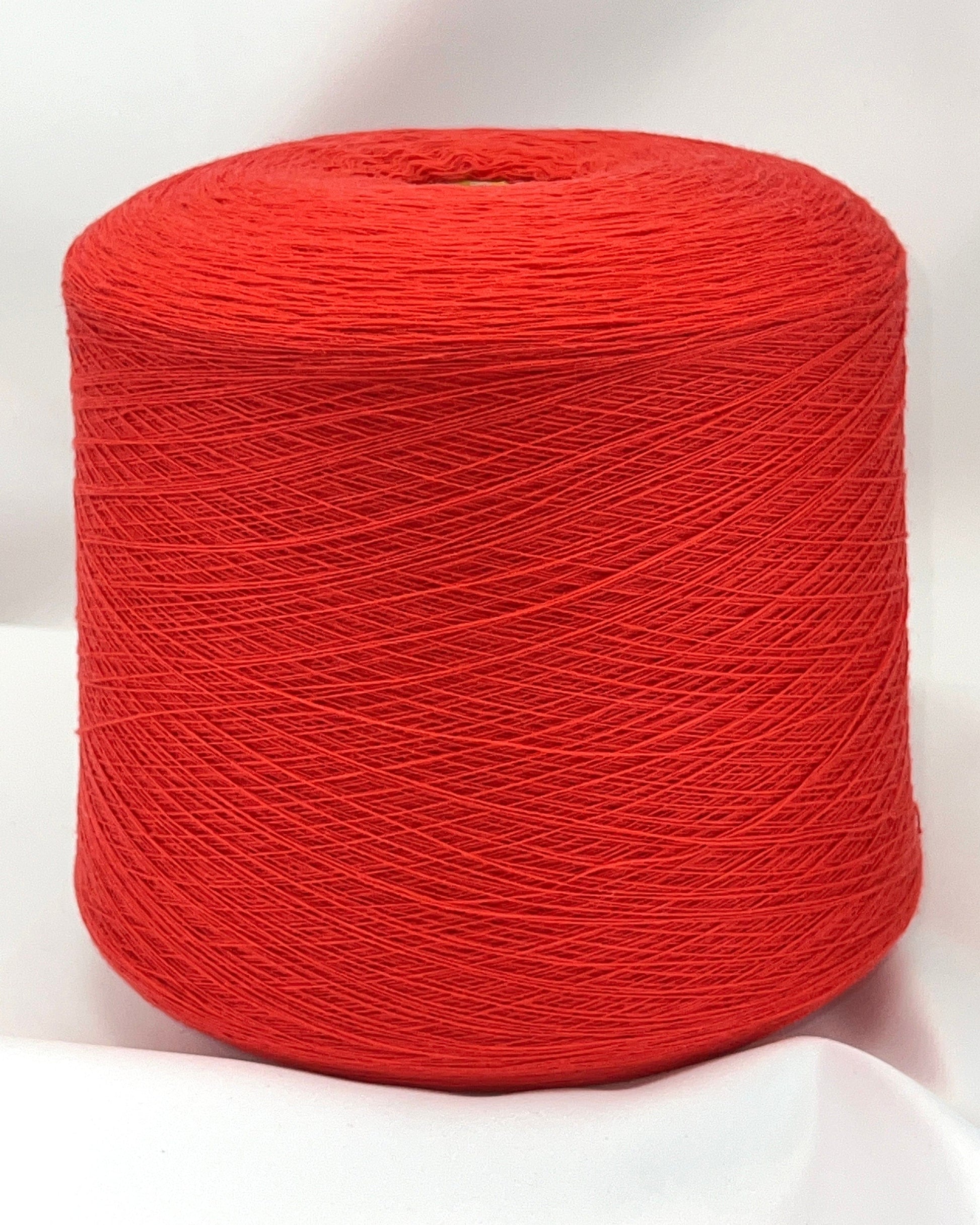 Red spool of yarn on a white background