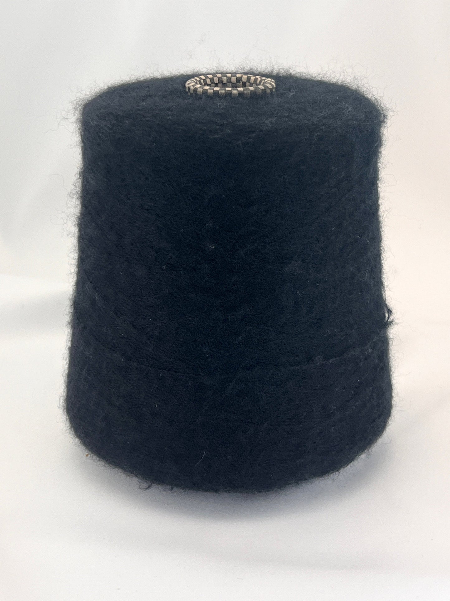 Black yarn cone on a white background