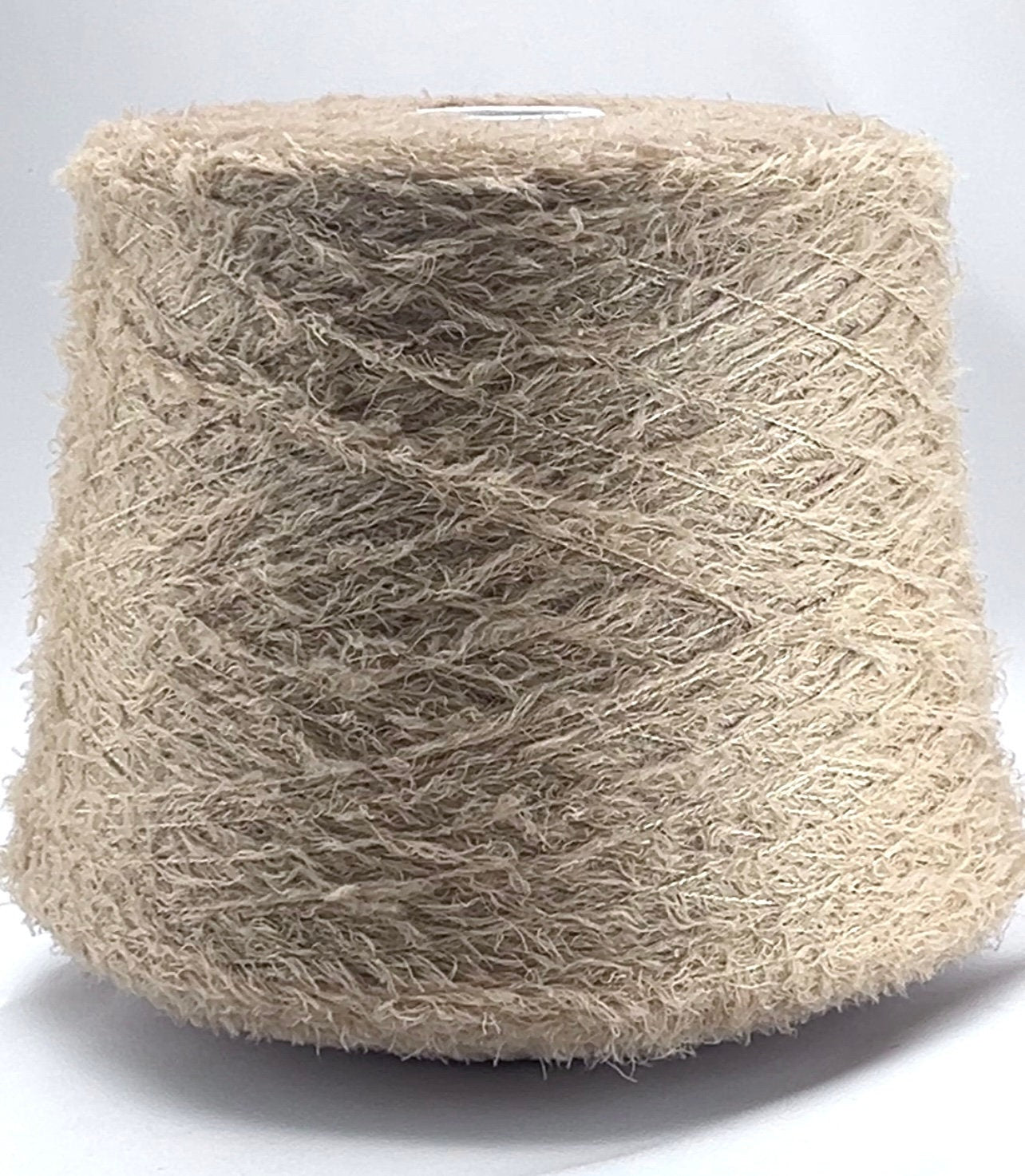 Beige yarn on a white background