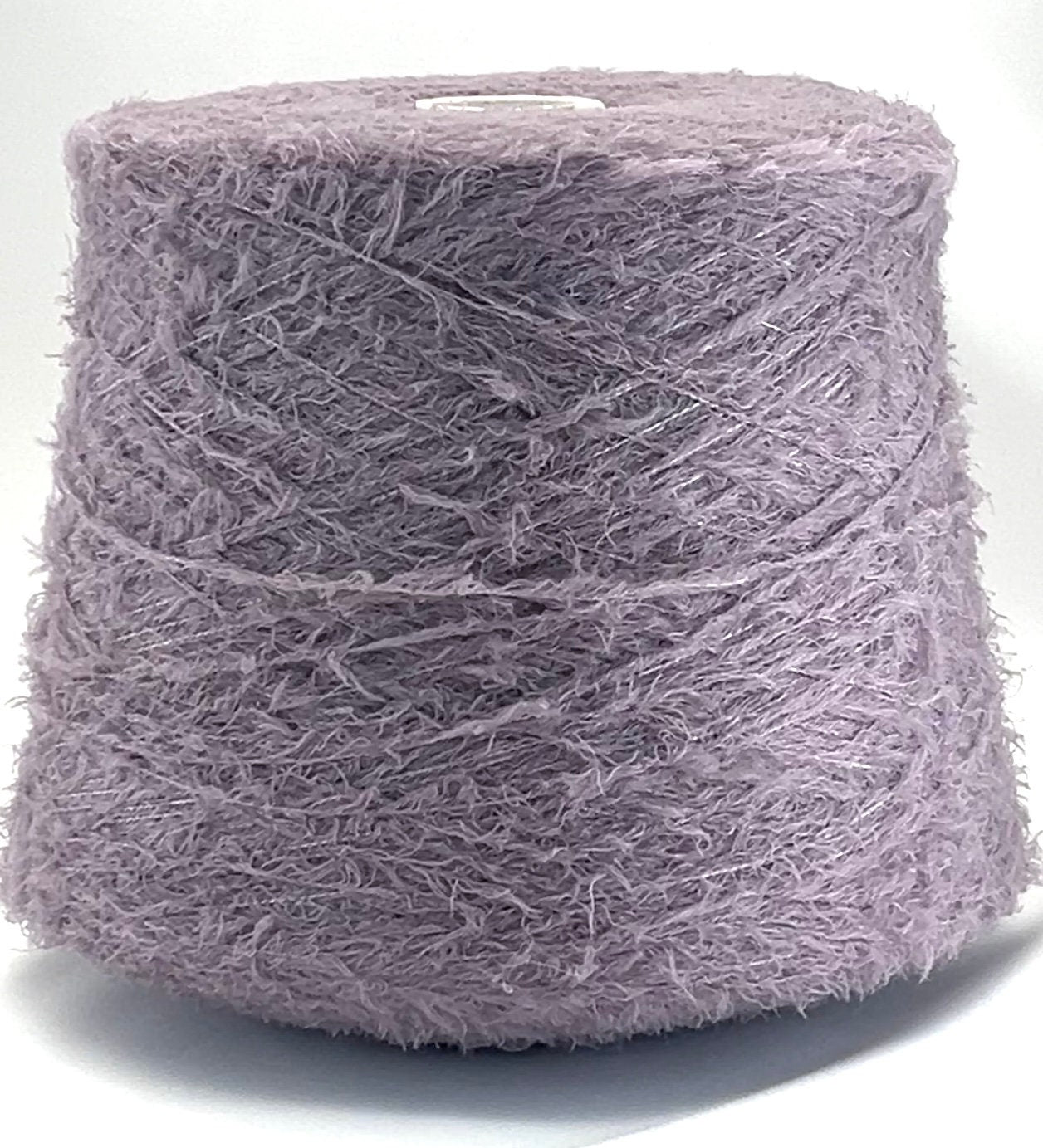Spool of purple yarn on a white background