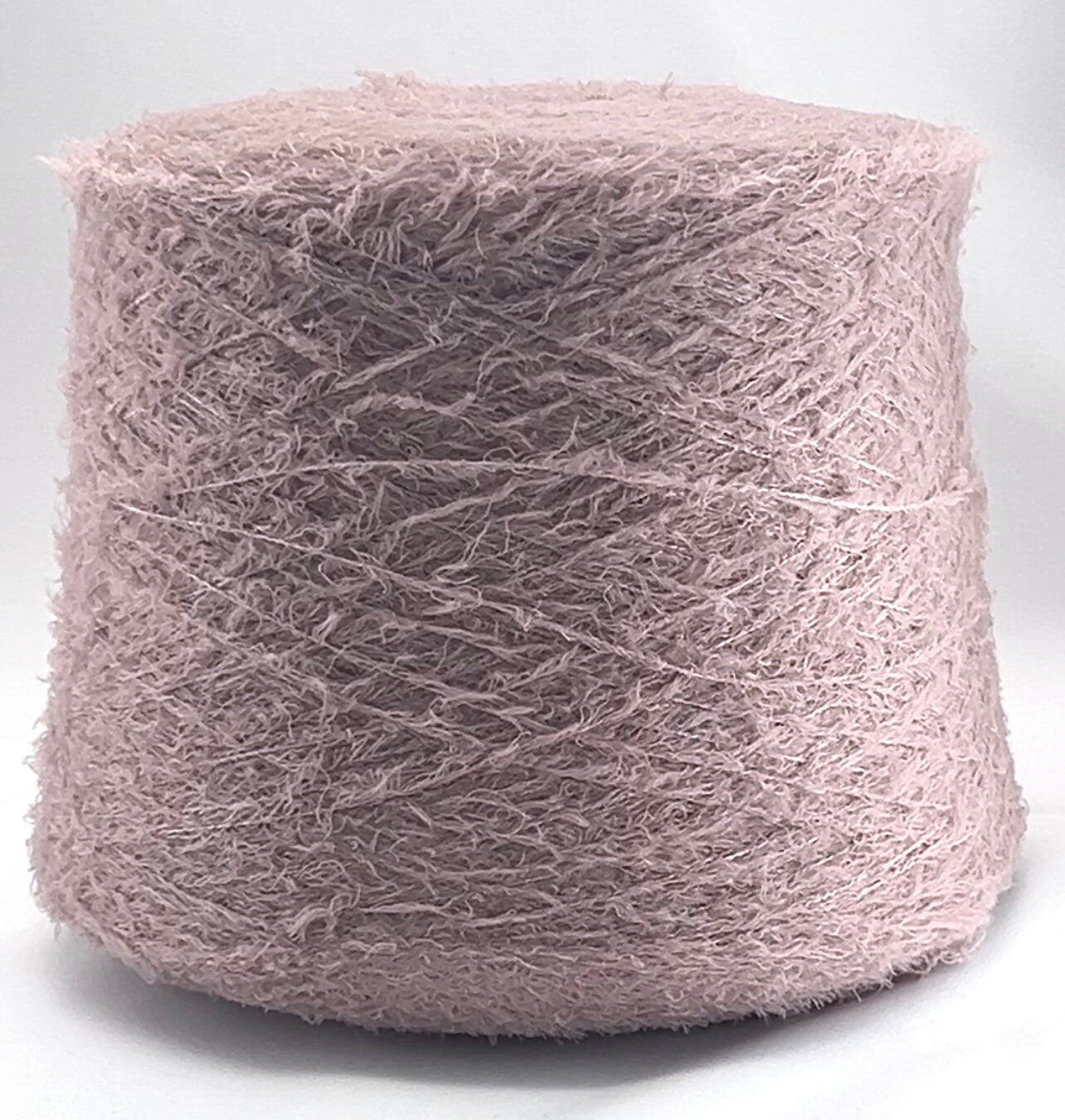 Pink yarn ball on a white background