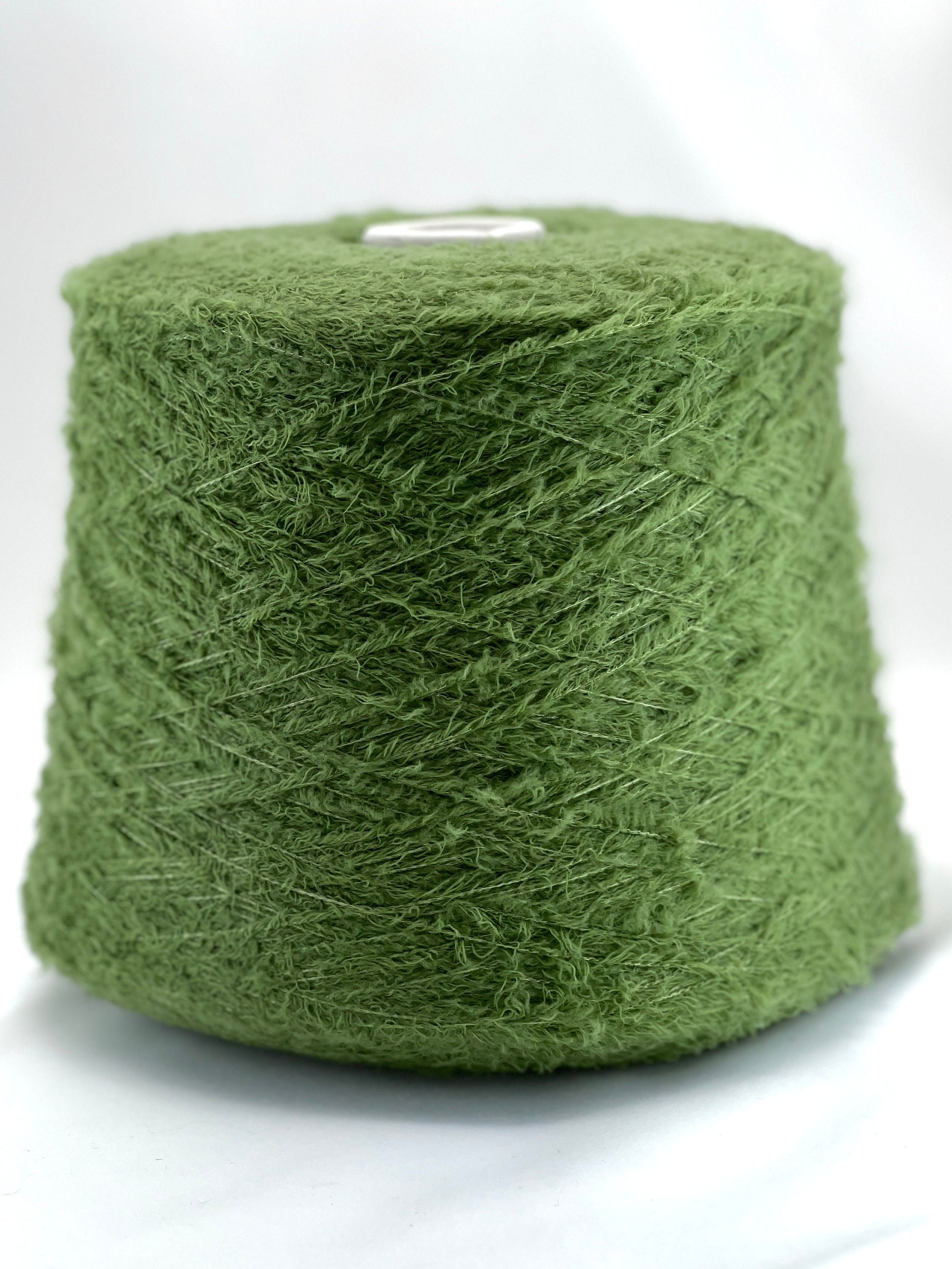 Green yarn ball on a white background