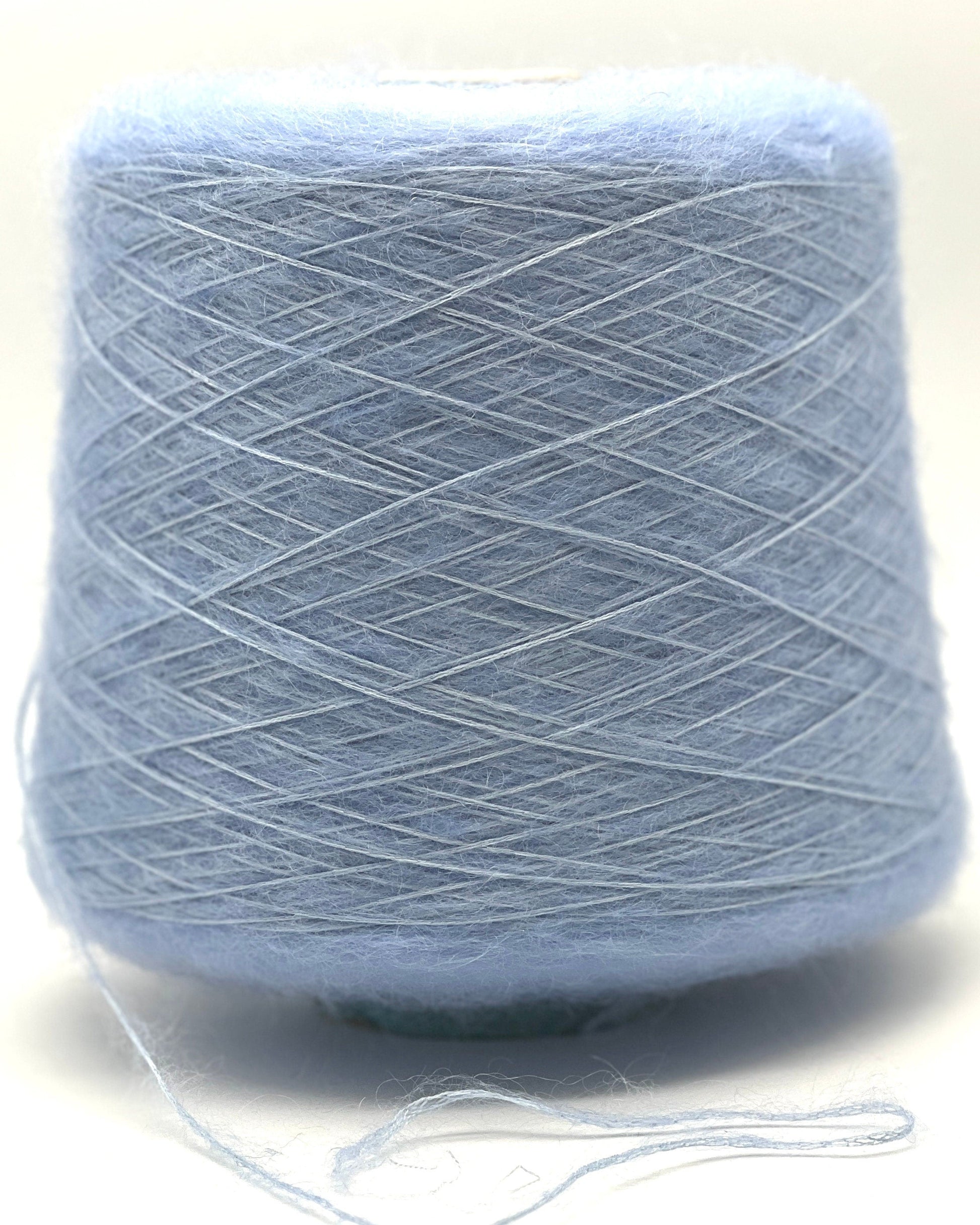 Light blue skein of yarn on a white background