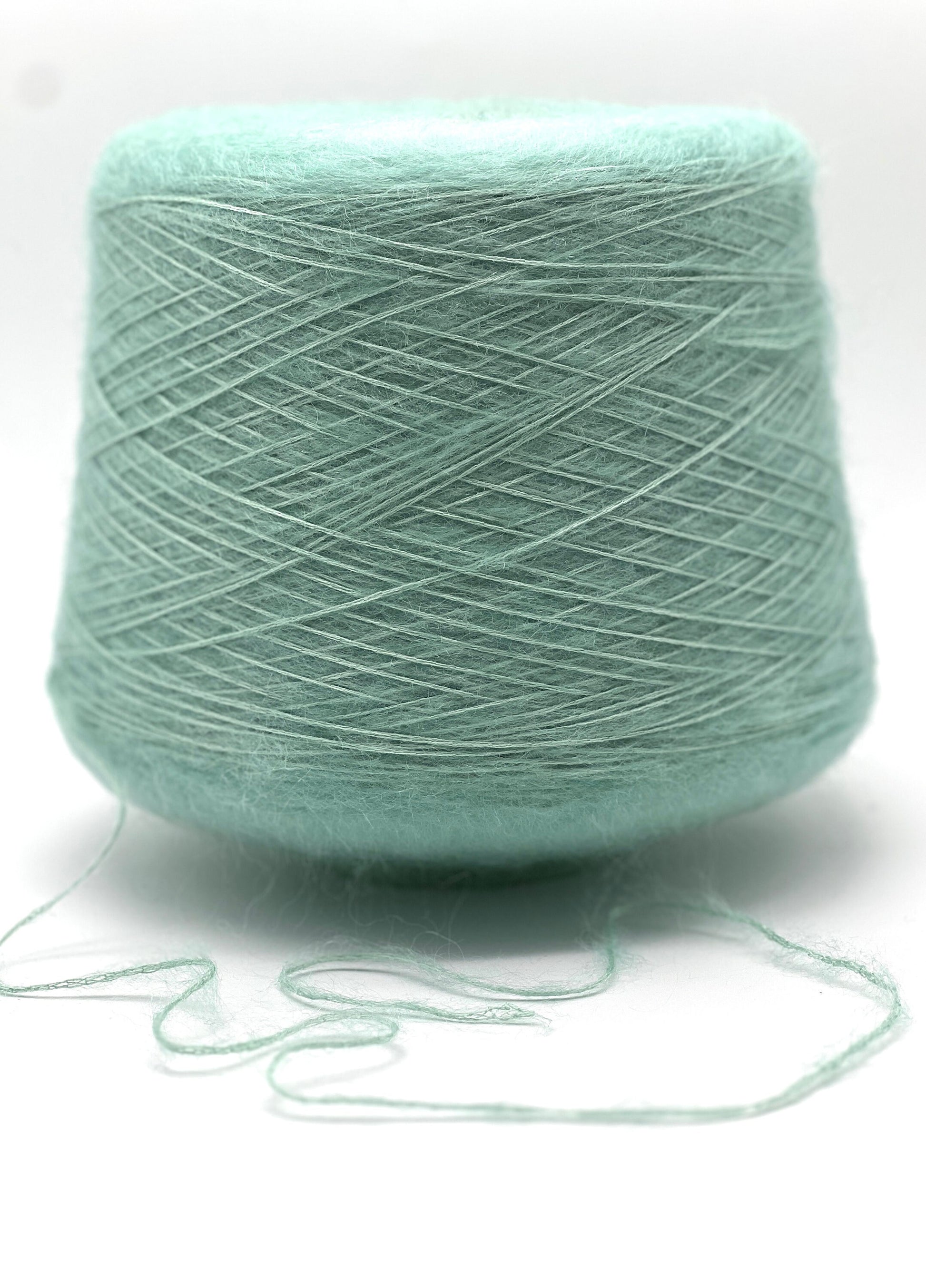 Light blue skein of yarn on a white background