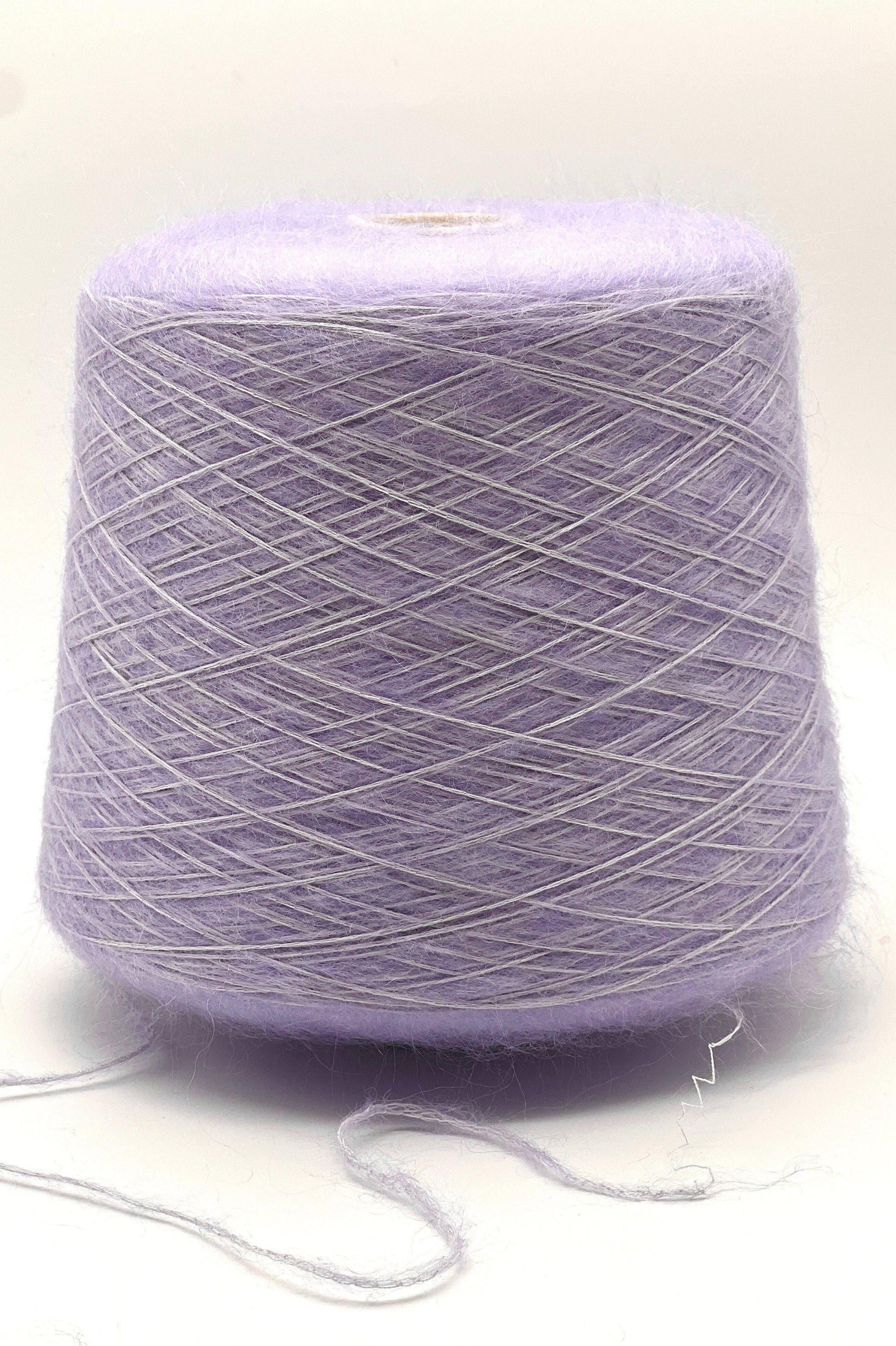 Lavender yarn cone on a white background