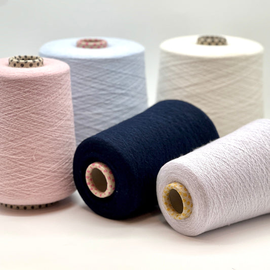 iDOKNiT exclusive: Close-up of Biagioli Modesto VANITY ZERMATT luxury yarn in boucle-style slub texture, a fine Italian cashmere-merino-viscose blend ideal for multi-strand handknitting and machine knitting.