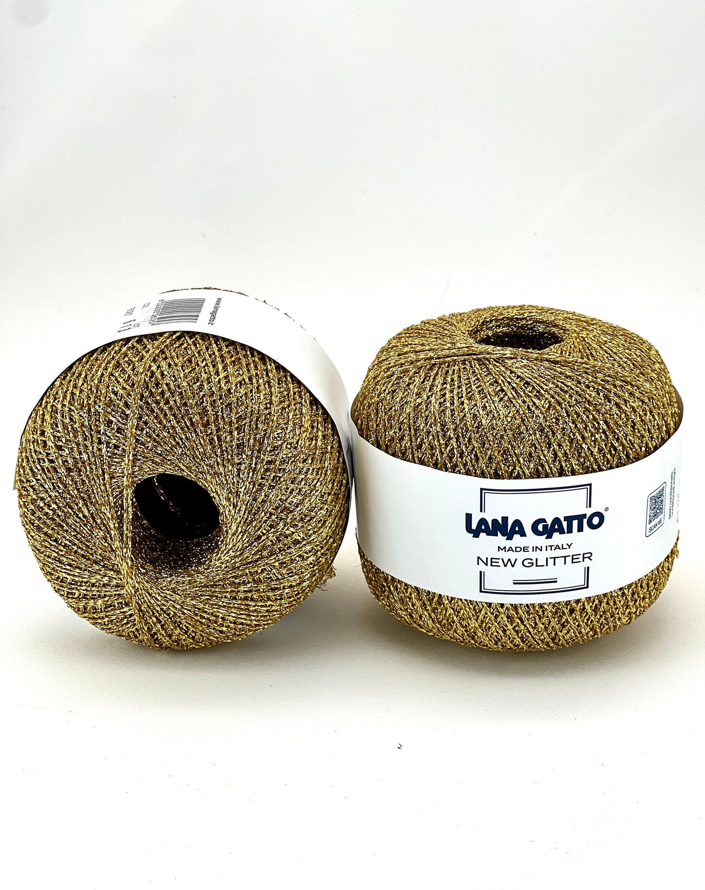 Two balls of yarn with a visible label on a white background