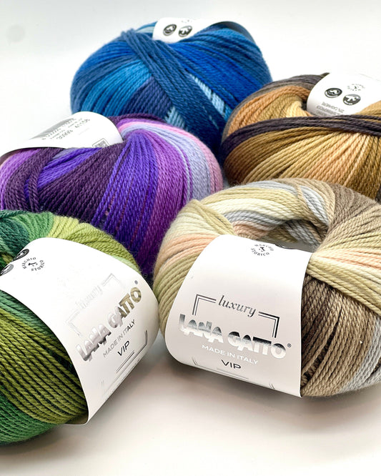 Assorted skeins of yarn in various colors with 'Lana Grossa' labels on a white background.