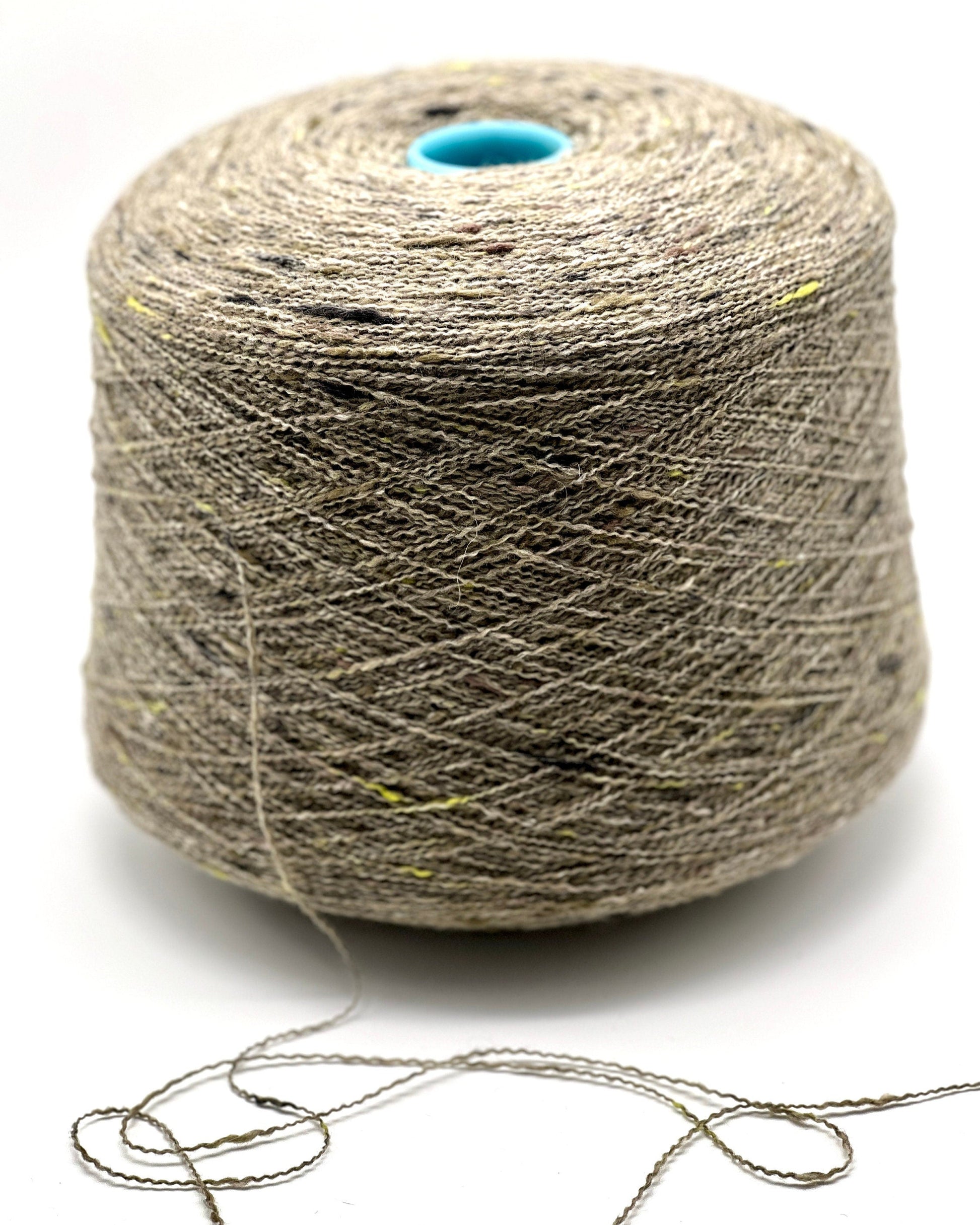 Spool of gray yarn on a white background