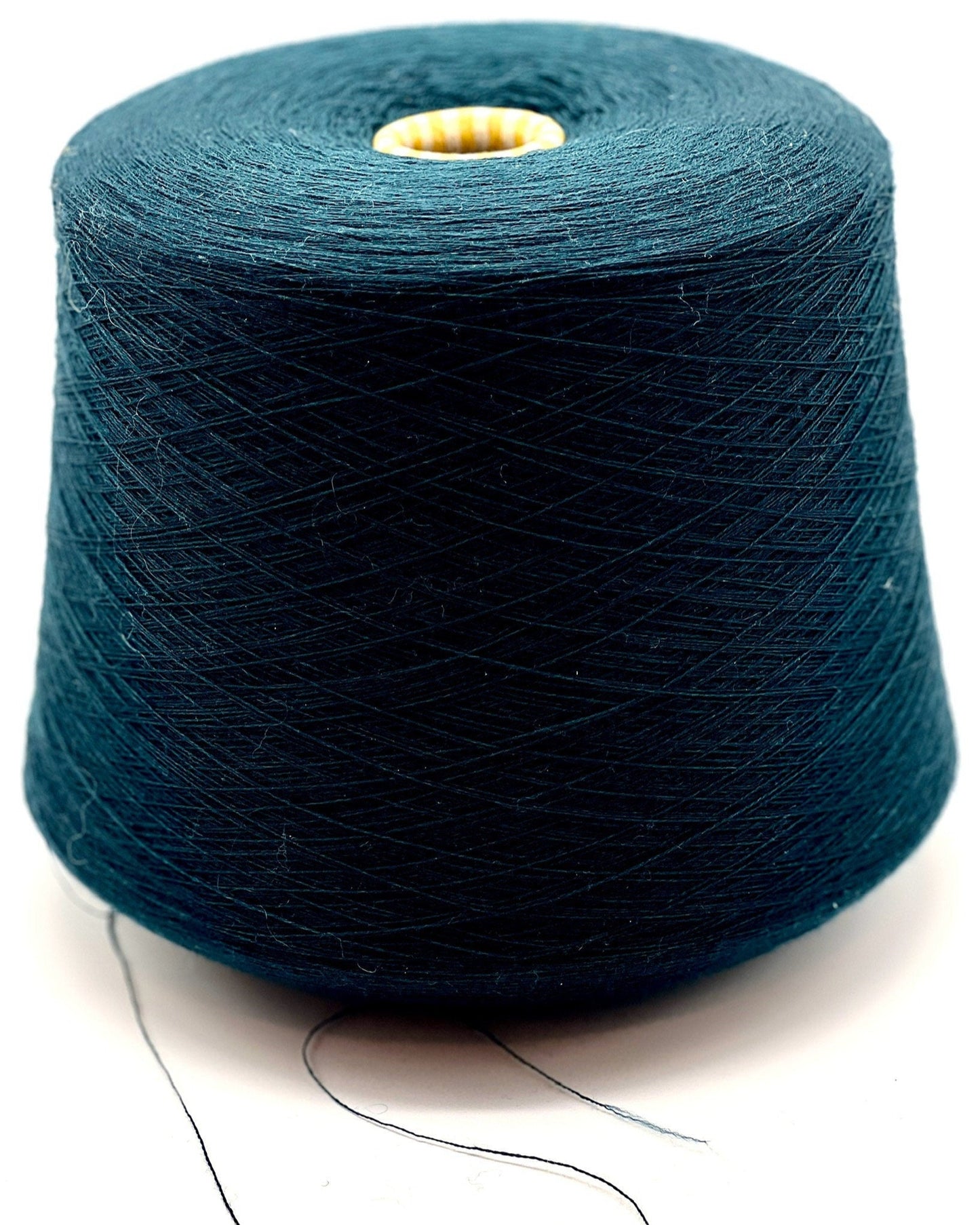 Blue spool of yarn on a white background