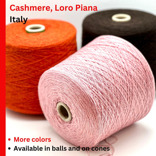 Three spools of yarn in orange, pink, and black with text about Cashmere, Loro Piana, and Italy.