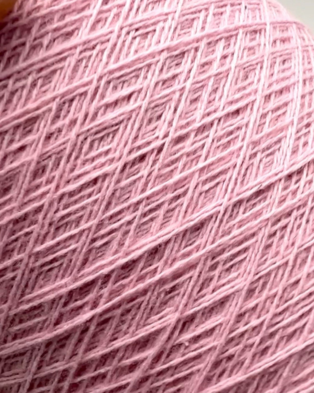 Close-up of pink yarn with a textured pattern