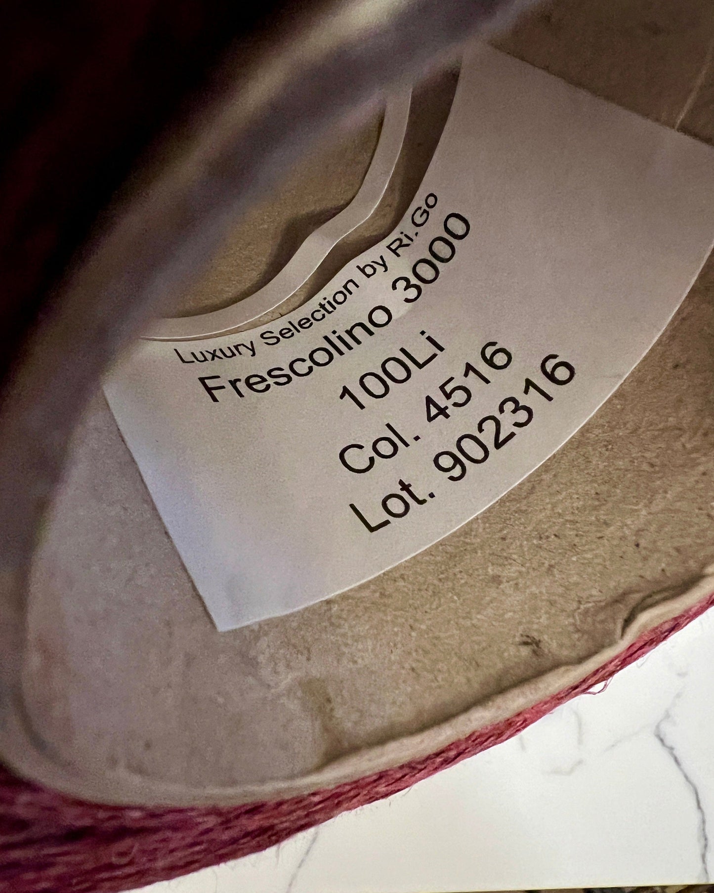 Close-up of a label on a wine bottle with text and numbers.