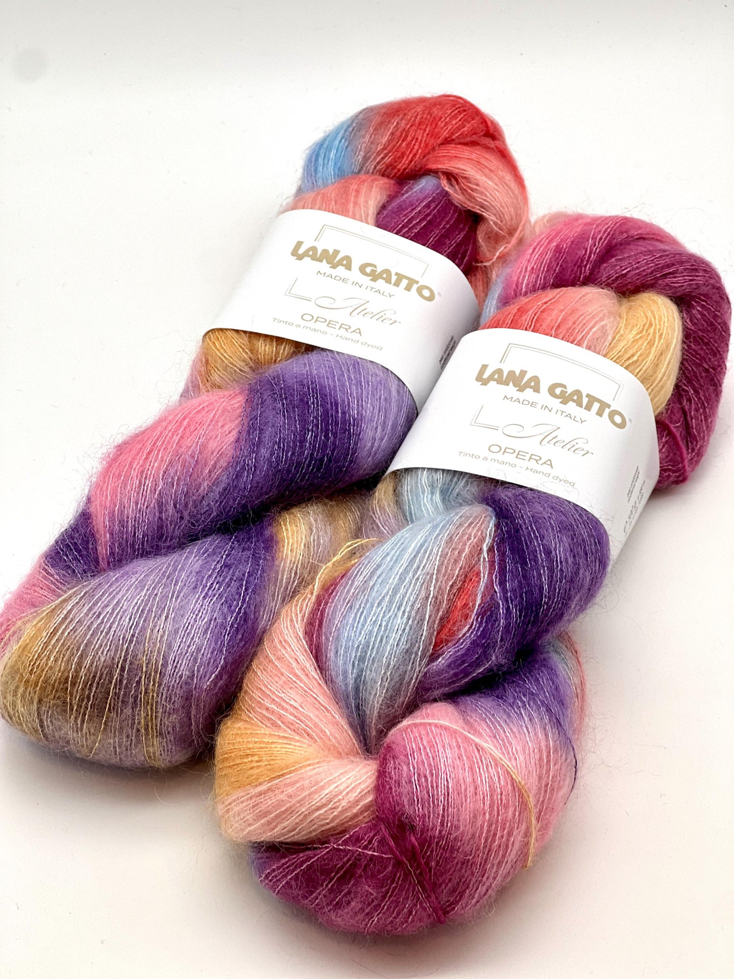 Two skeins of colorful yarn with 'Lana Grossa' labels on a white background