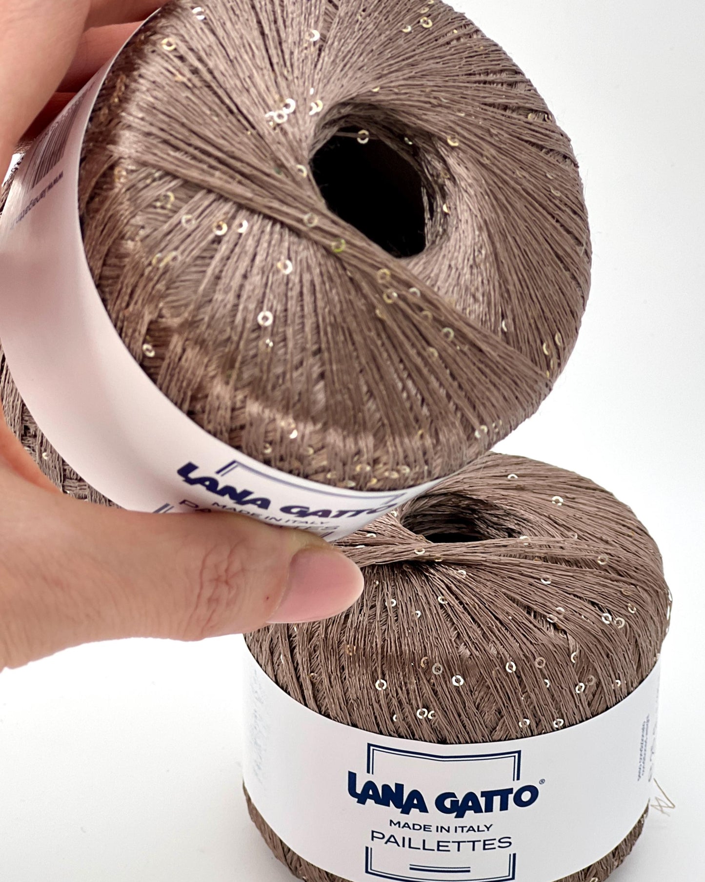 Lana Gatto Paillettes yarn in shimmering pastel tones, with delicate 2mm sequins, lightweight polyester yarn ideal for adding sparkle to knit or crochet projects. Made in Italy. 30100 Camel color.