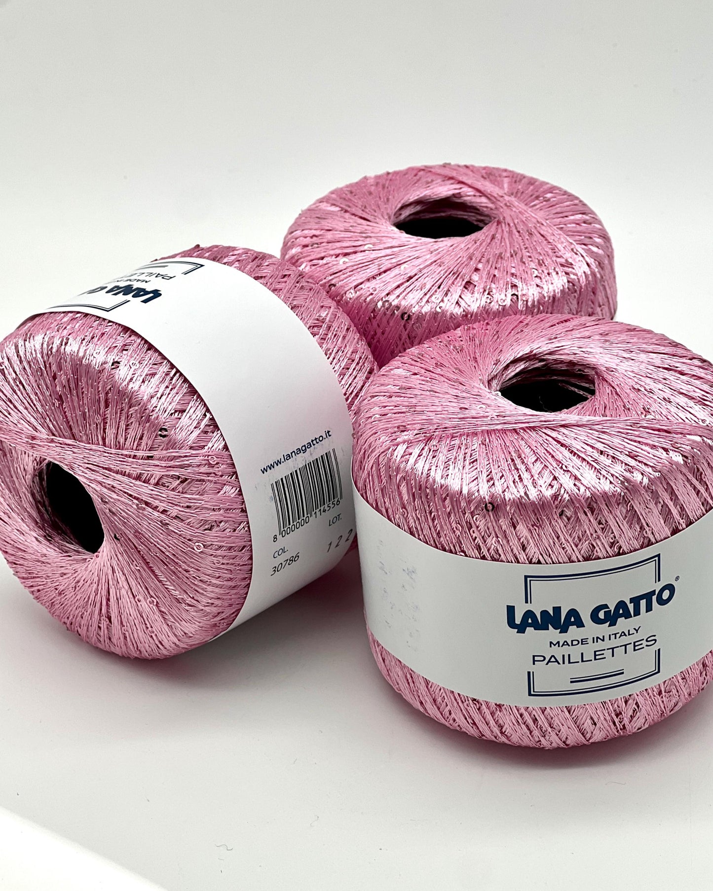 Lana Gatto Paillettes yarn in shimmering pastel tones, with delicate 2mm sequins, lightweight polyester yarn ideal for adding sparkle to knit or crochet projects. Made in Italy. 30786 candy pink color.