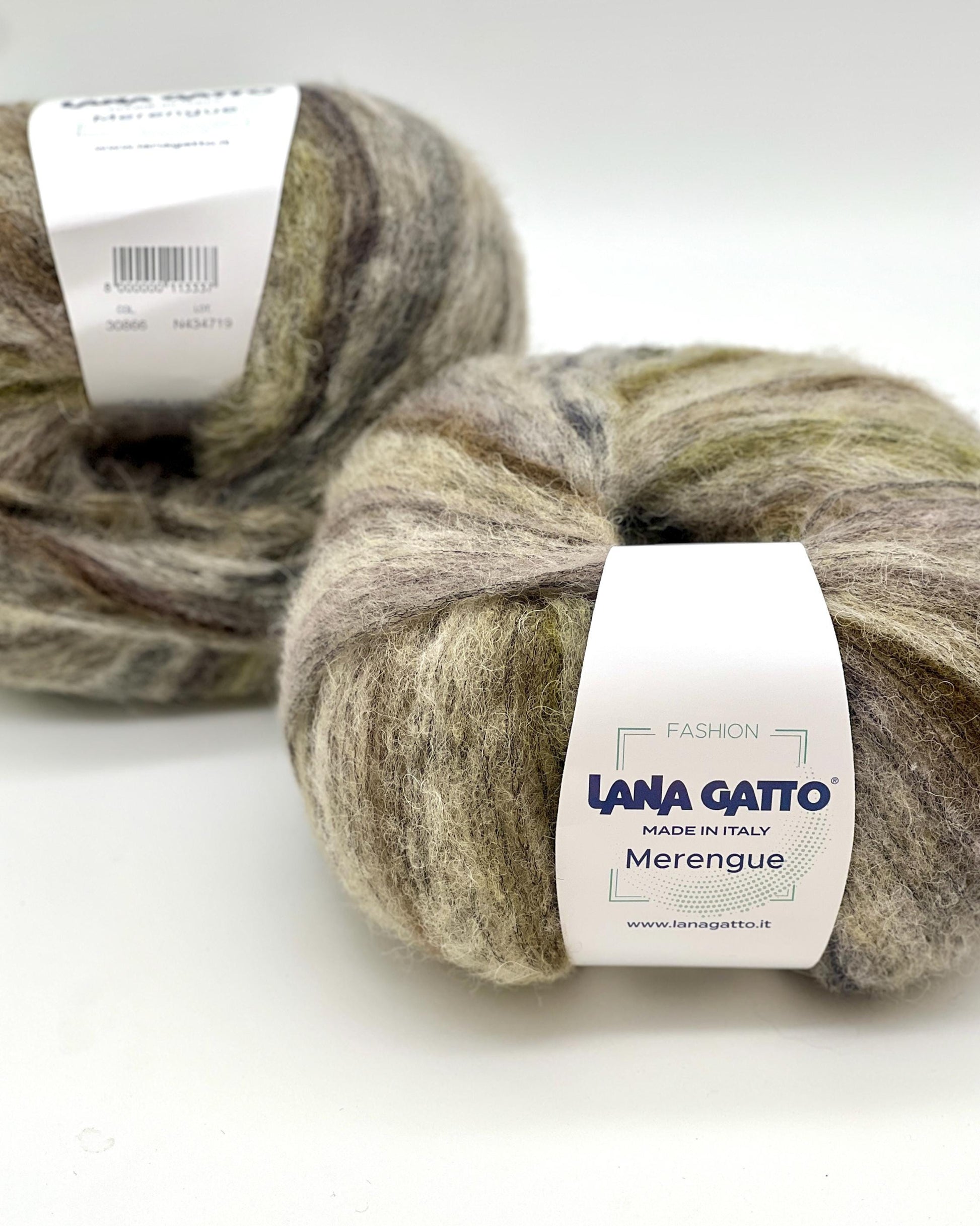 Two balls of yarn with 'Lana Gatto' labels on a white background