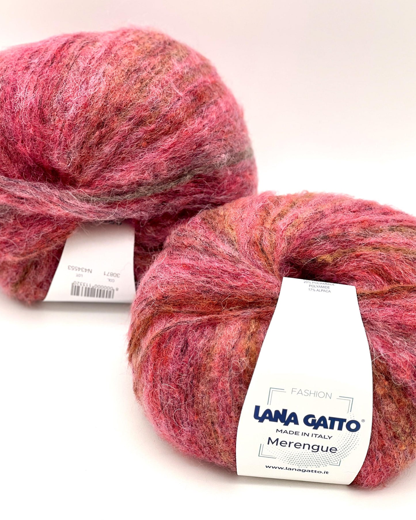 Two skeins of pink yarn with 'Lana Gatto' labels on a white background