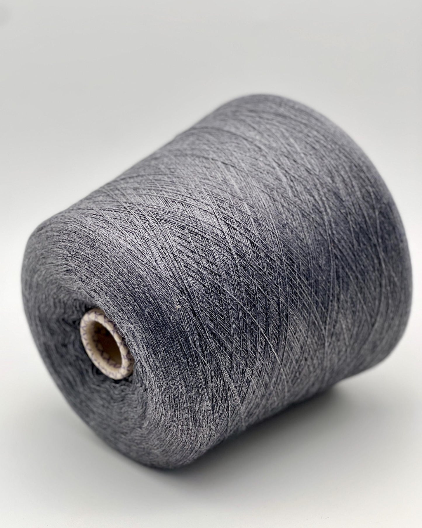 Gray yarn cone on a white background