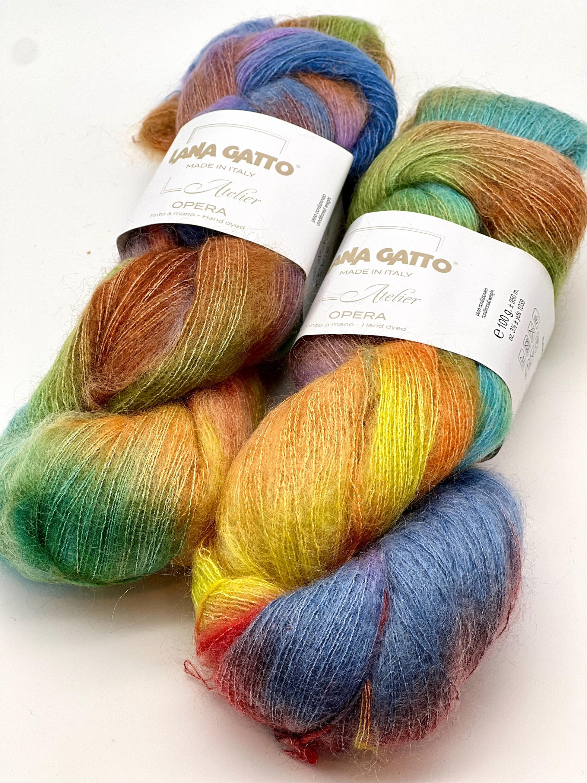 Two skeins of colorful yarn with Lana Gatto labels on a white background