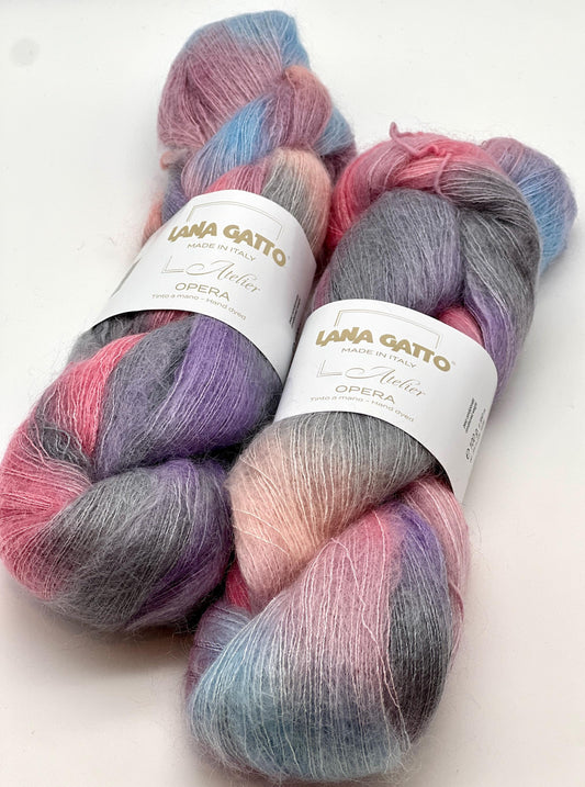 Two skeins of multicolored yarn with 'Lana Gatto' labels on a white background