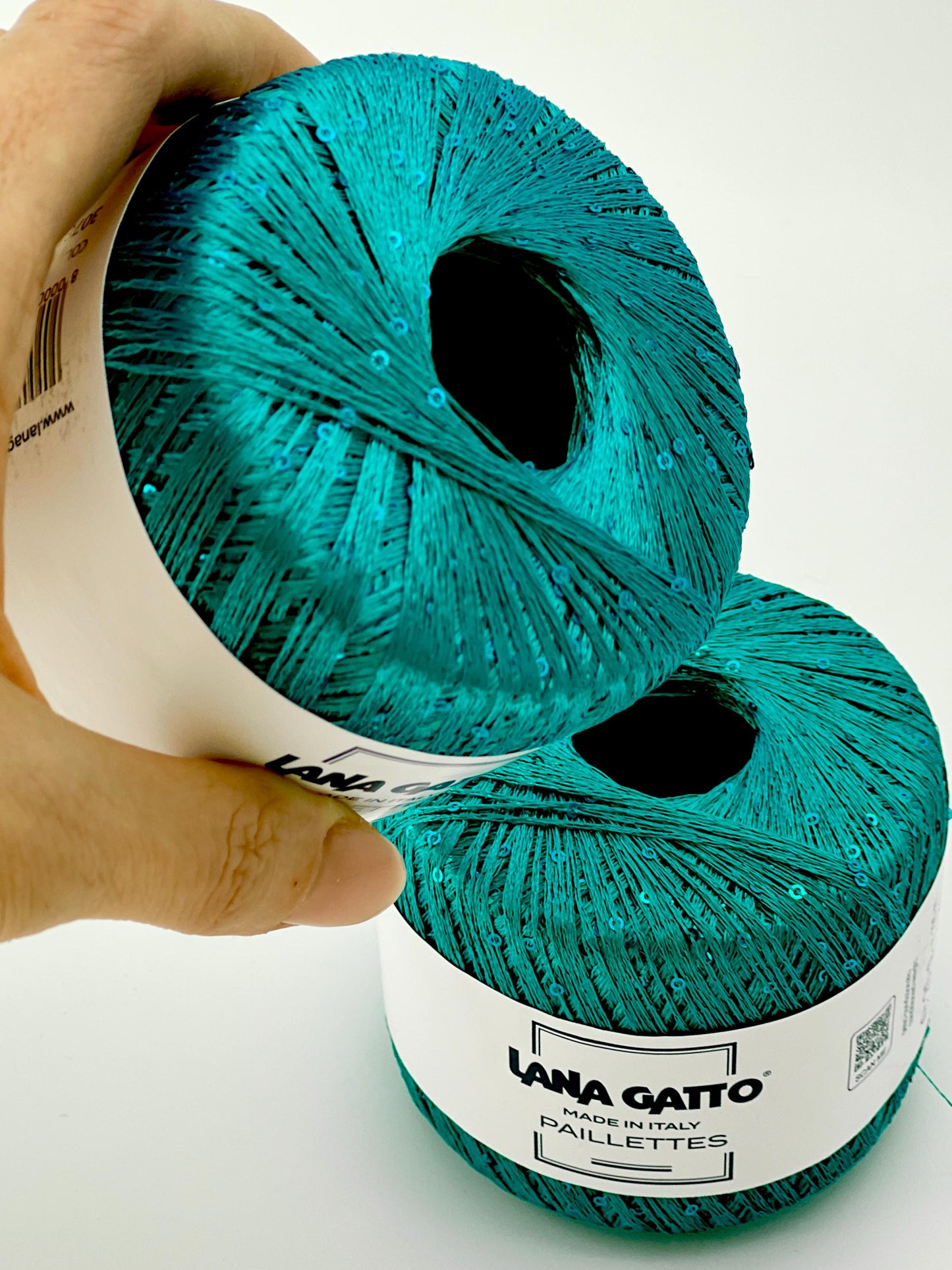 Lana Gatto Paillettes yarn in shimmering pastel tones, with delicate 2mm sequins, lightweight polyester yarn ideal for adding sparkle to knit or crochet projects. Made in Italy. 30785 PEACOCK GREEN color.