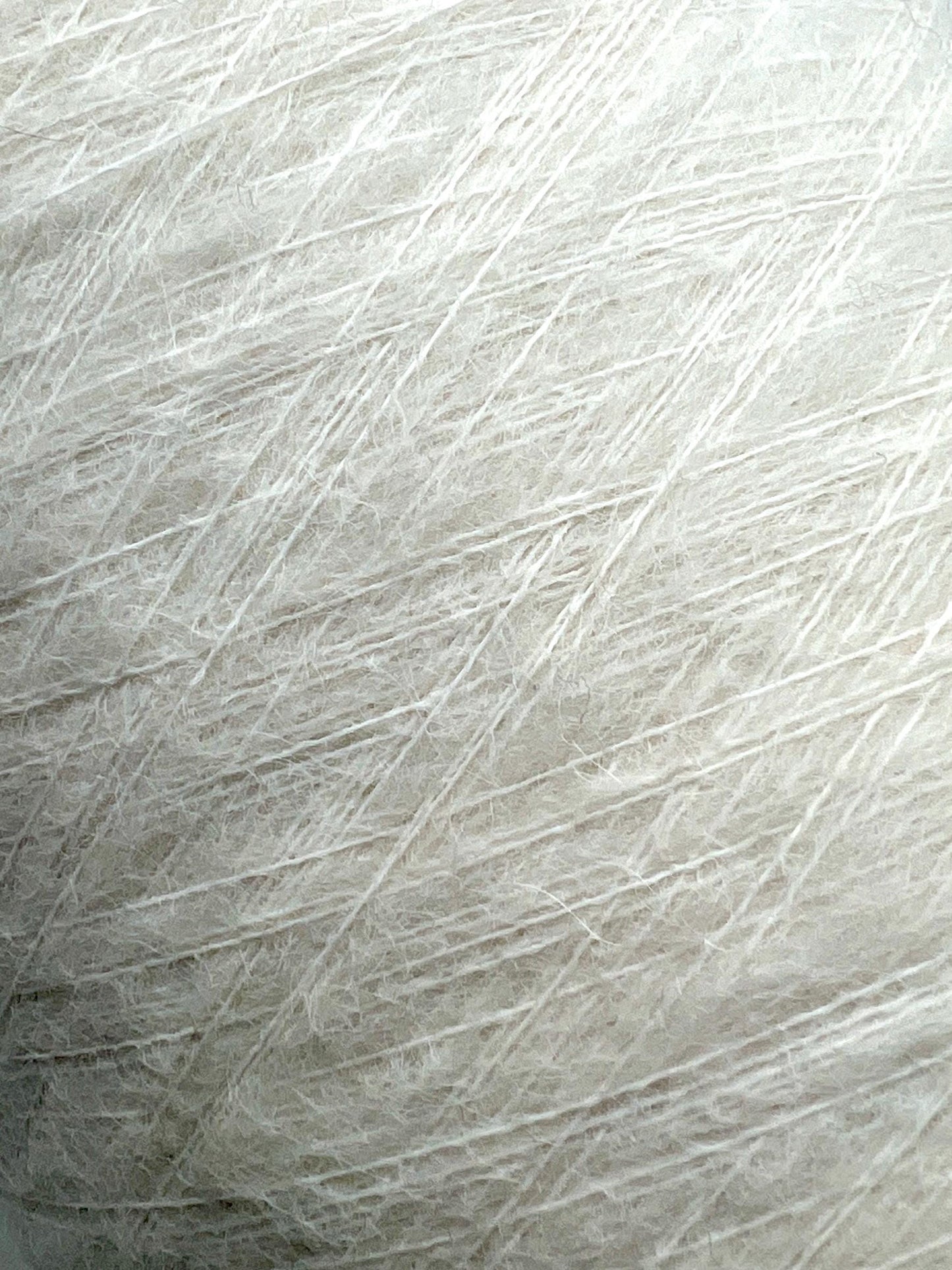 Close-up of white yarn with a textured pattern