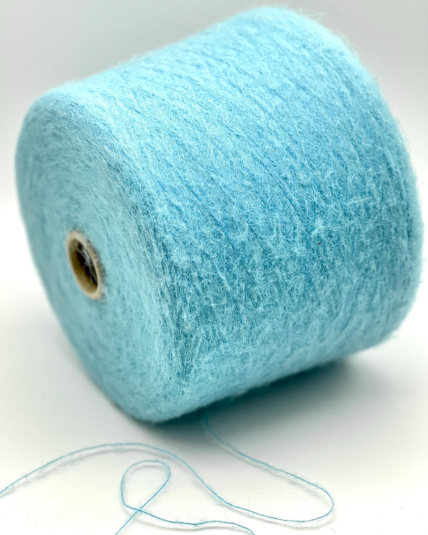 Blue yarn roll on a white background