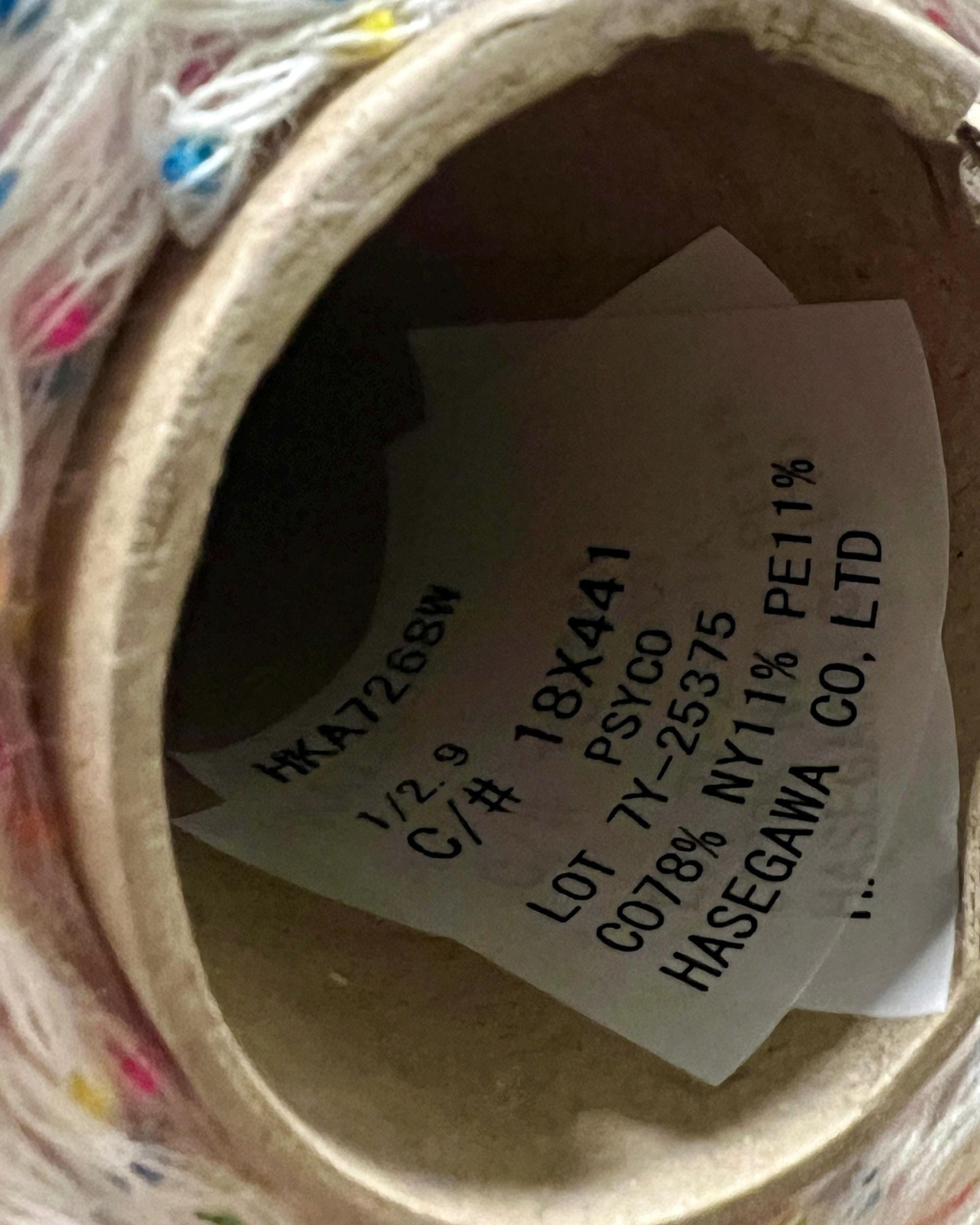 Close-up of a label inside a product with text and numbers.