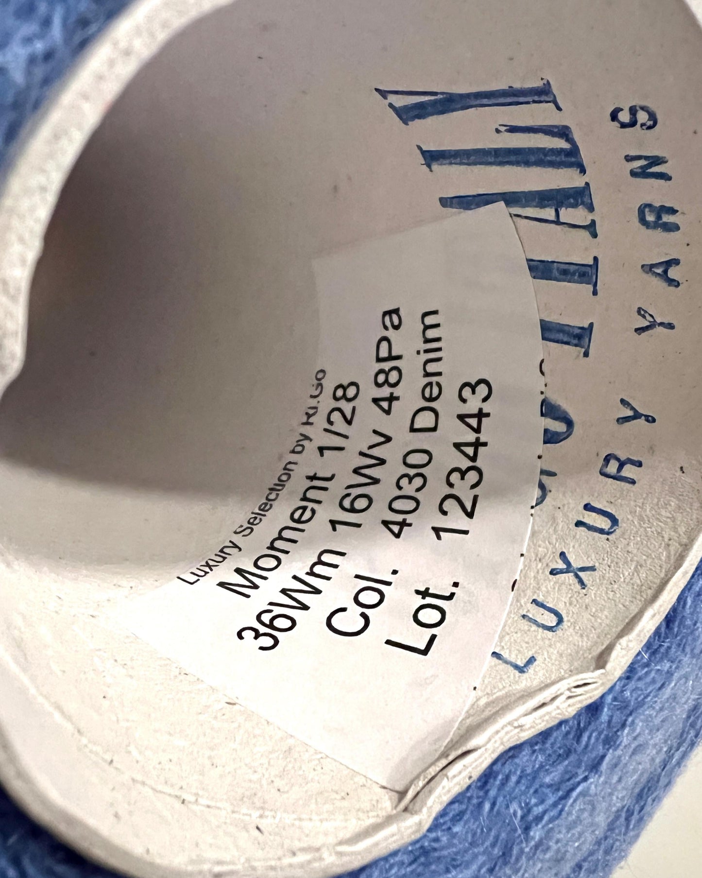 Close-up of a yarn label with text on a white background