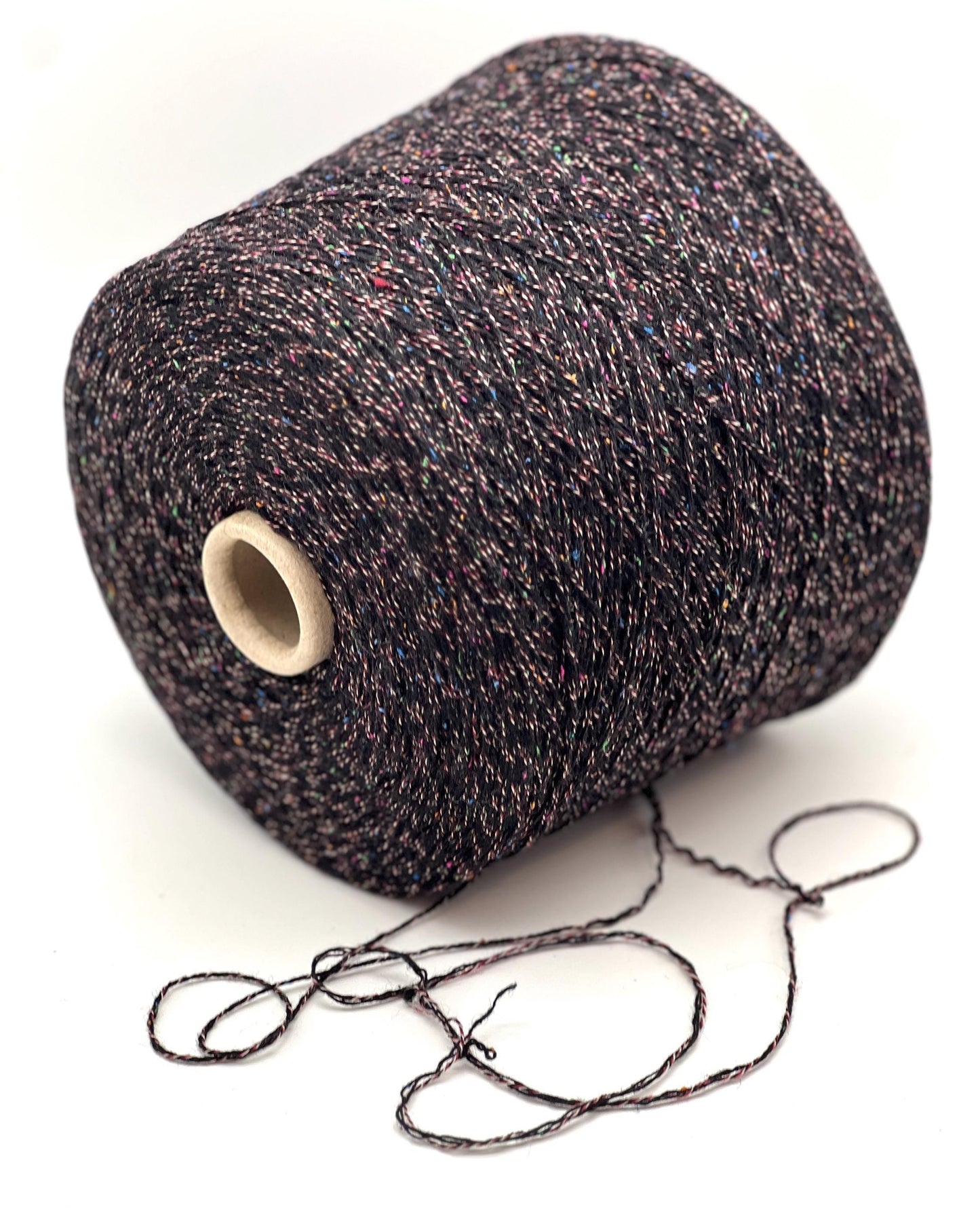 Spool of dark brown yarn on a white background