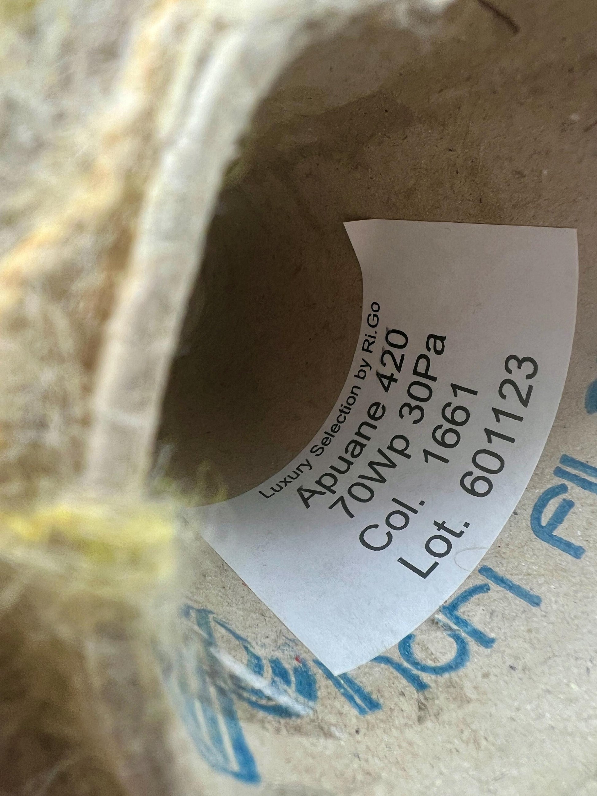 Close-up of a label on a cardboard box with text and numbers.