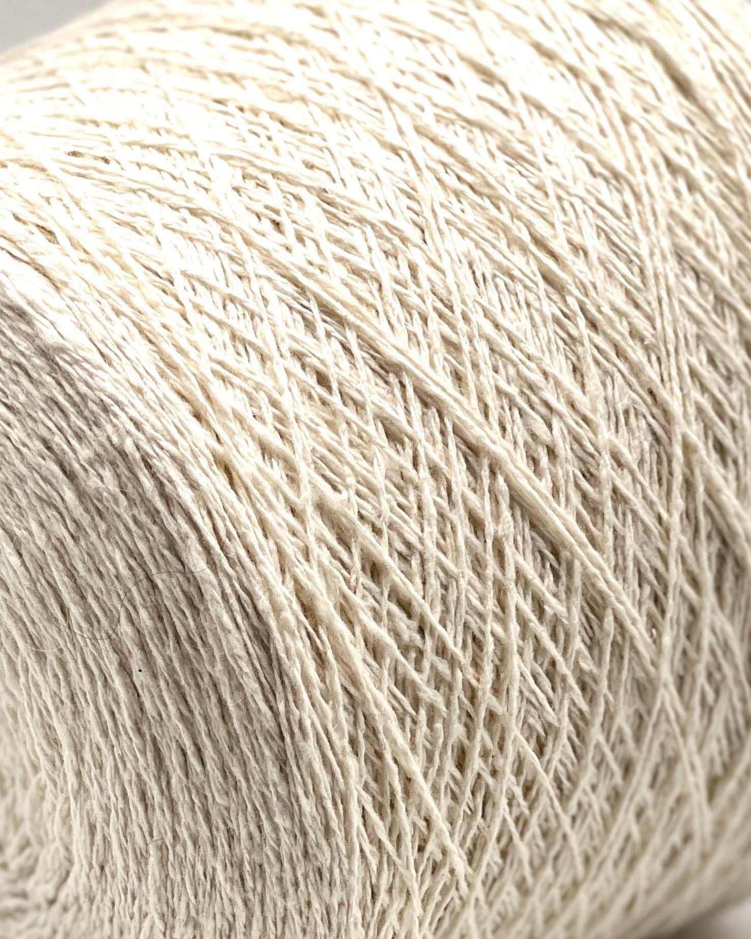 Close-up of beige yarn on a light background