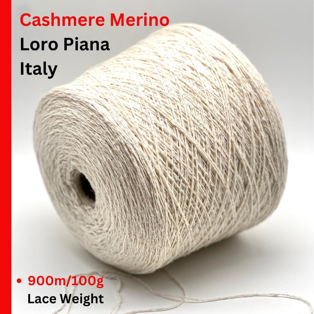 Spool of Loro Piana Cashmere Merino yarn on a white background with text indicating brand and product details.