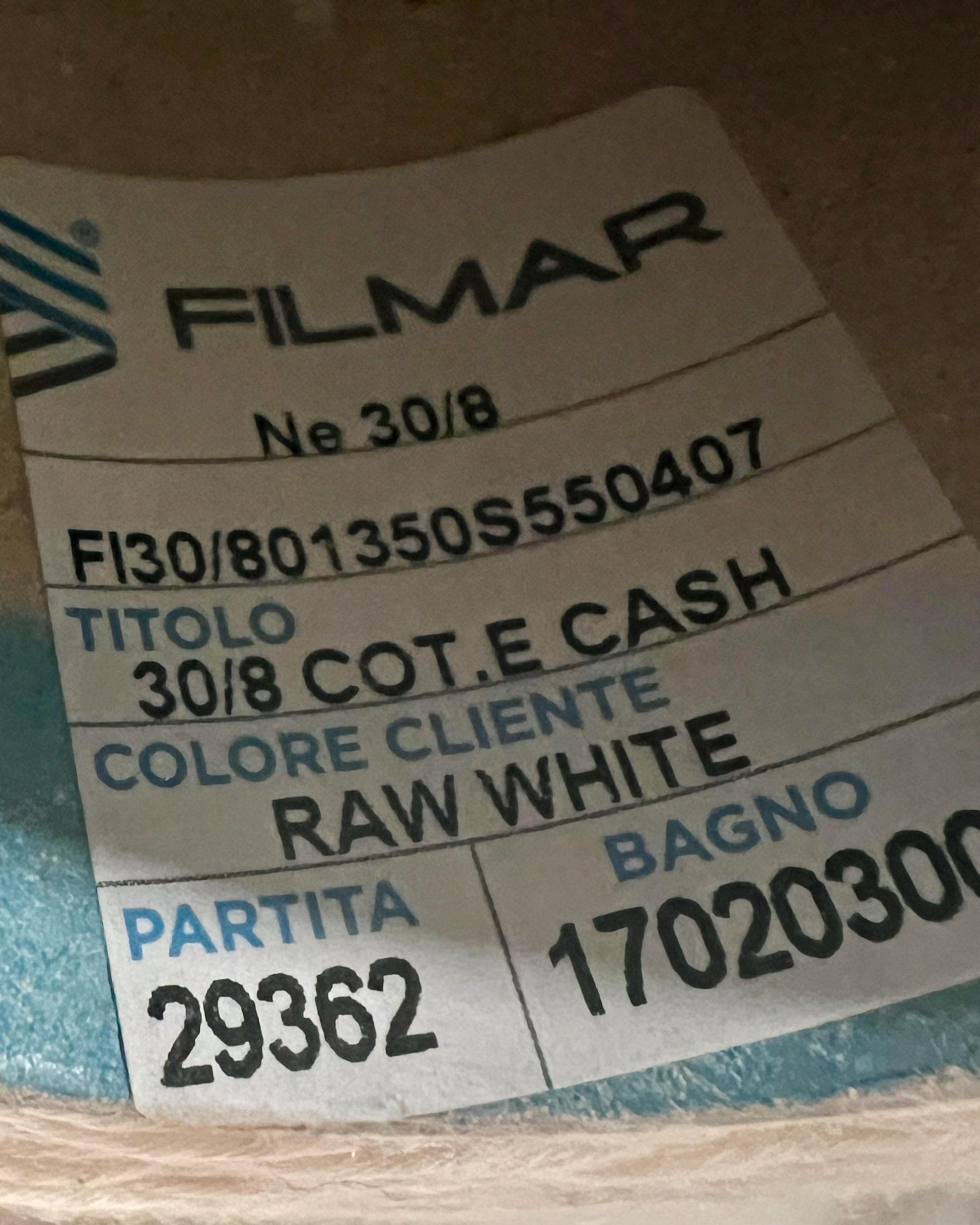 Product label with 'Filmar' branding and various text details on a blurred background